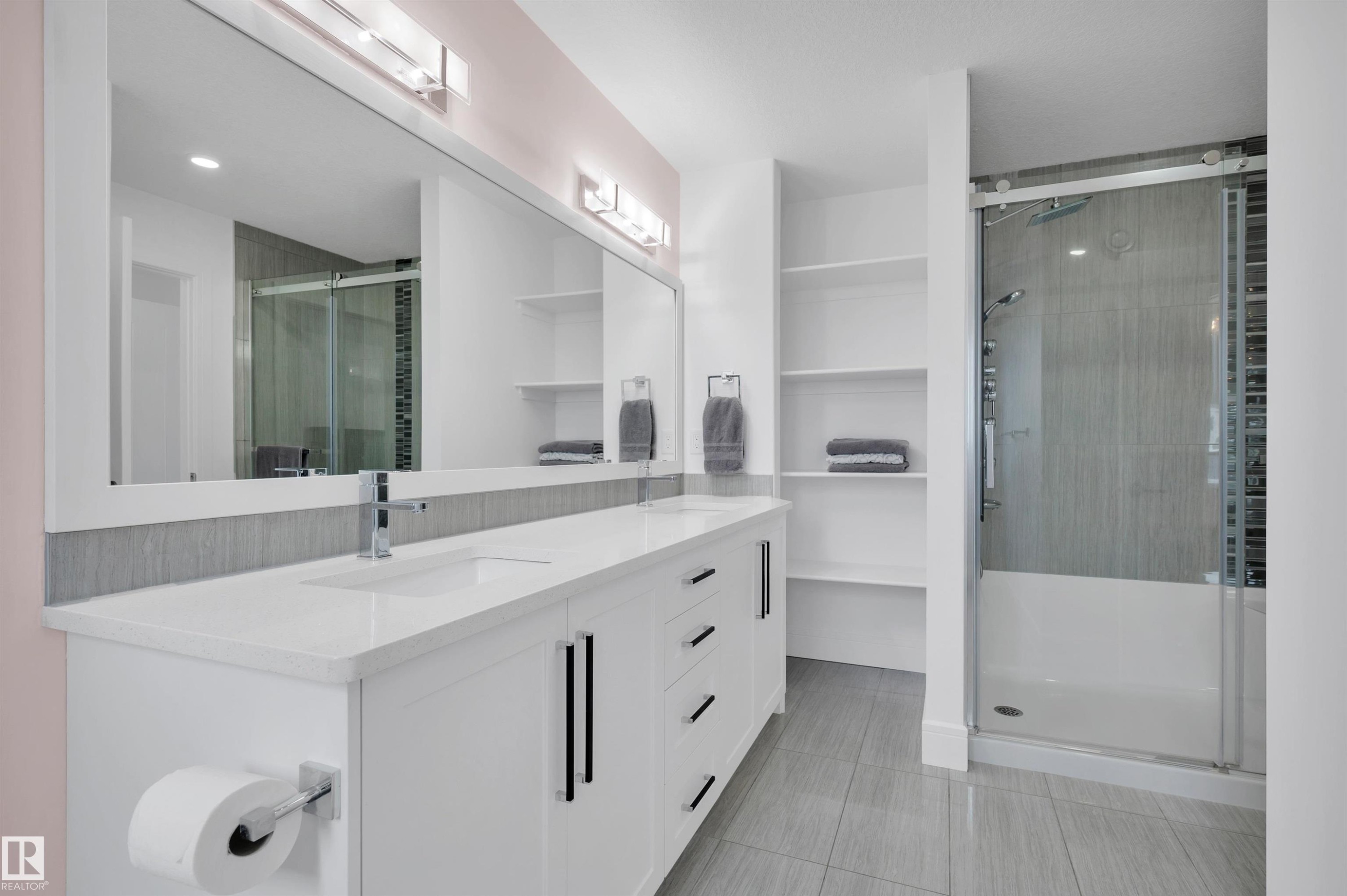 Double vanity with white cabinetry, integrated sinks, and polished chrome fixtures - 3898 Robins Crescent Nw, Edmonton, AB - Indoor Photo Showing Bathroom