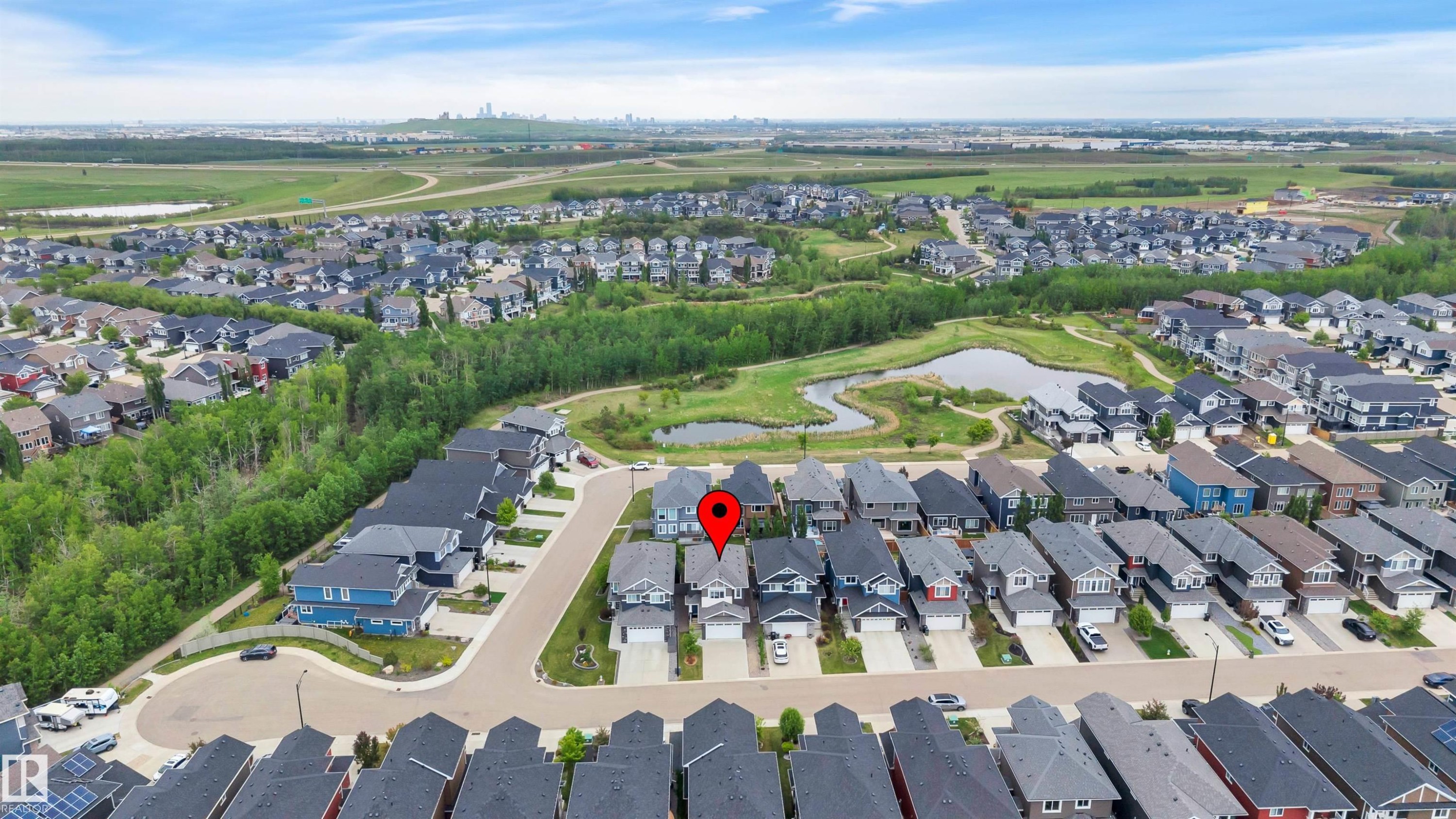 Aerial perspective showcasing a residential development with varied architectural styles - 3898 Robins Crescent Nw, Edmonton, AB - Outdoor With View