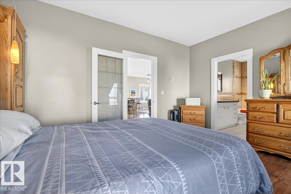 Hardwood-style flooring throughout - 5019 48 Avenue, Chipman, AB - Indoor Photo Showing Bedroom