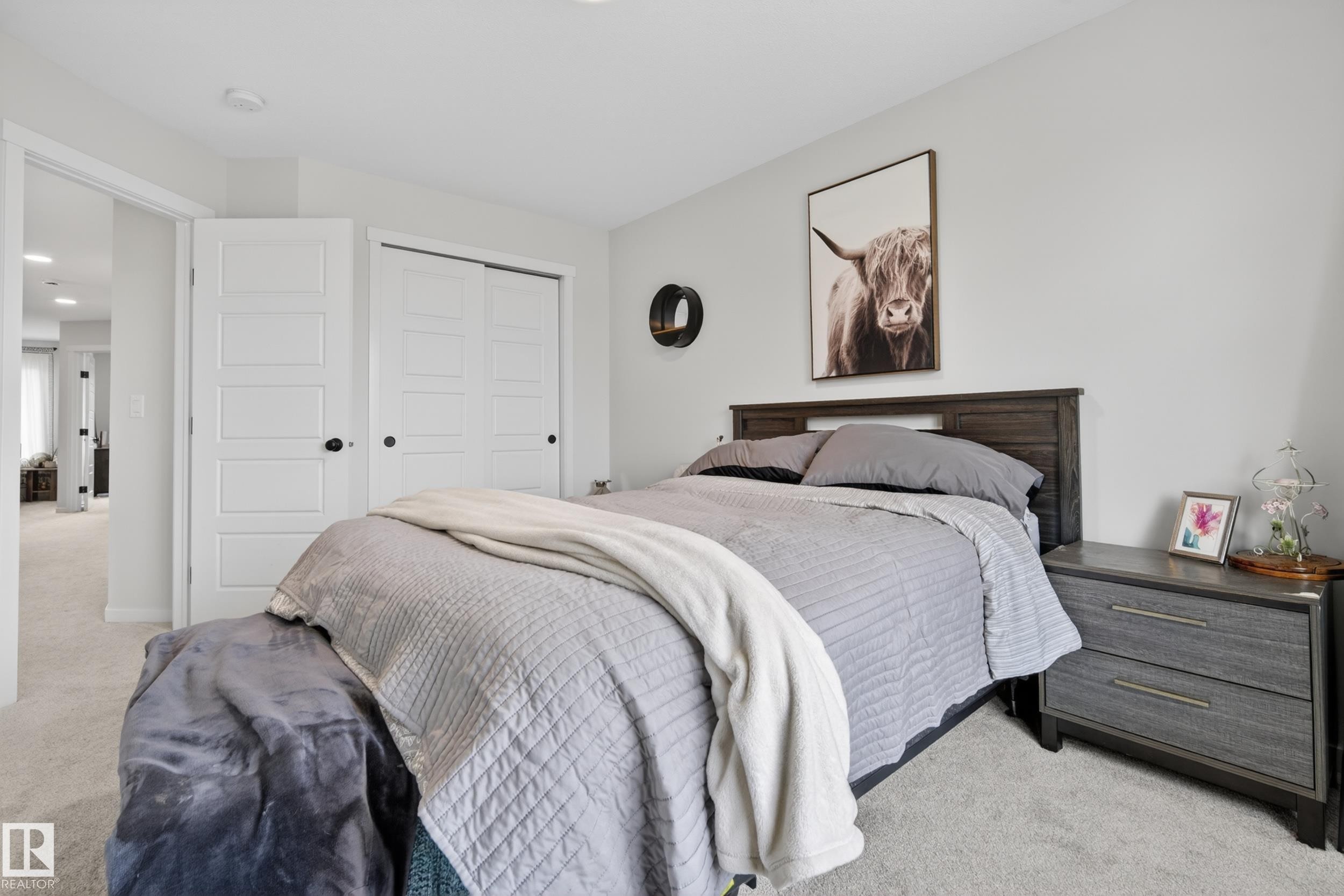 Neutral-toned bedroom featuring light grey walls and light-colored carpet flooring - 22836 94 Avenue, Edmonton, AB
