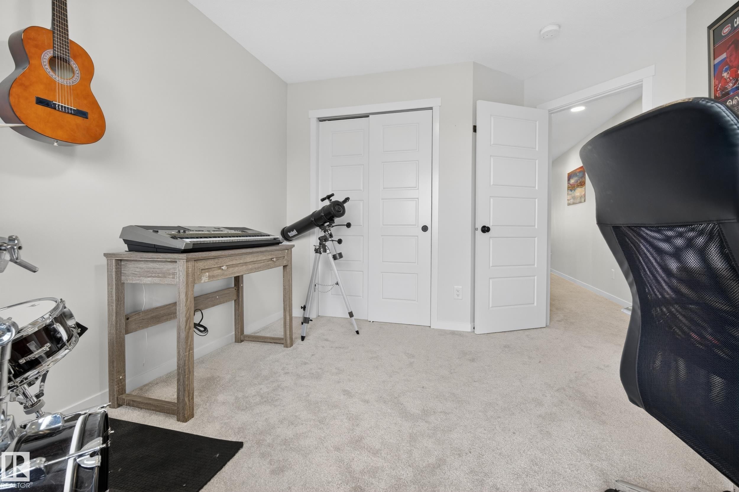 Light gray wall paint, light-colored carpet flooring, and white paneled doors - 22836 94 Avenue, Edmonton, AB