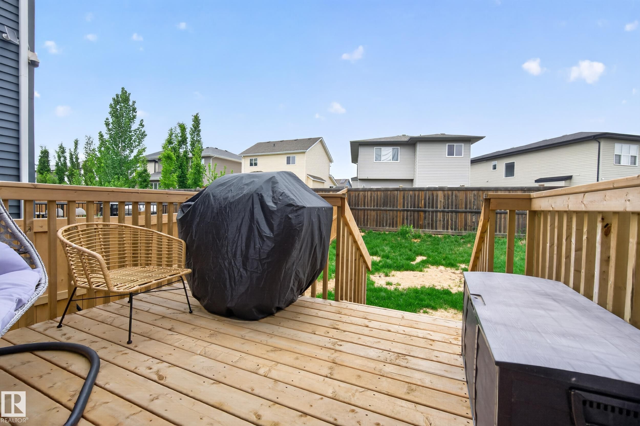 Expansive wood deck with a full railing system - 22836 94 Avenue, Edmonton, AB