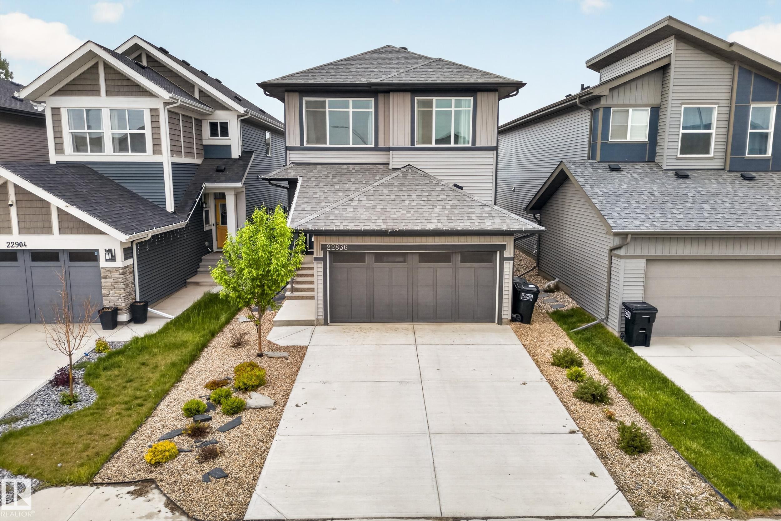 Contemporary two-story residence with a concrete driveway and an attached two-car garage - 22836 94 Avenue, Edmonton, AB