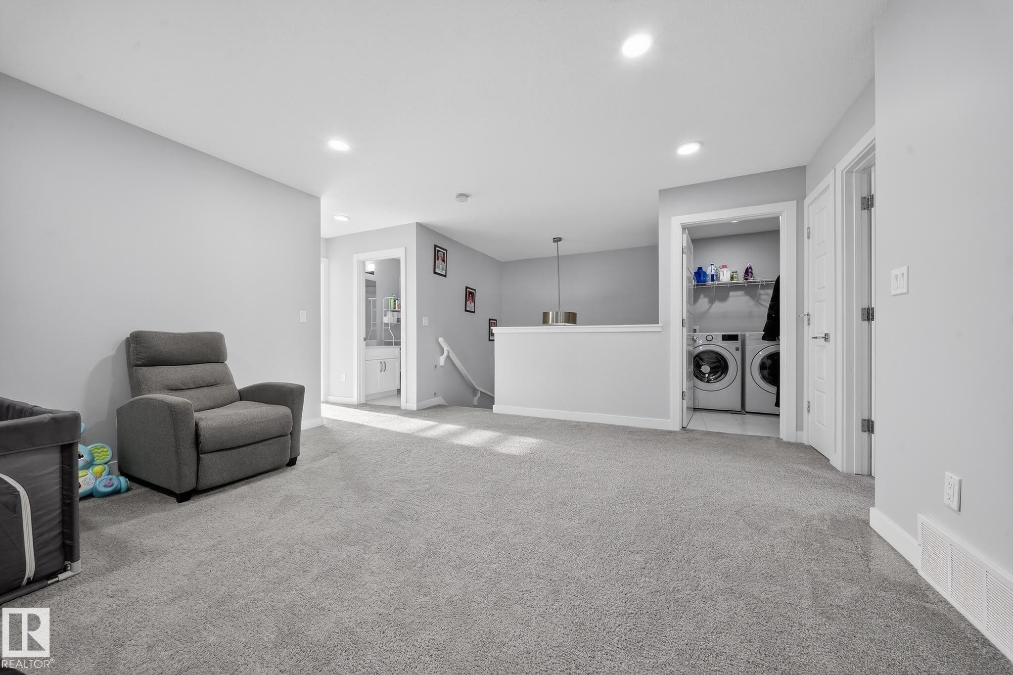 Carpeted room with light gray walls, featuring recessed lighting and white trim - 2084 Graydon Hill, Edmonton, AB