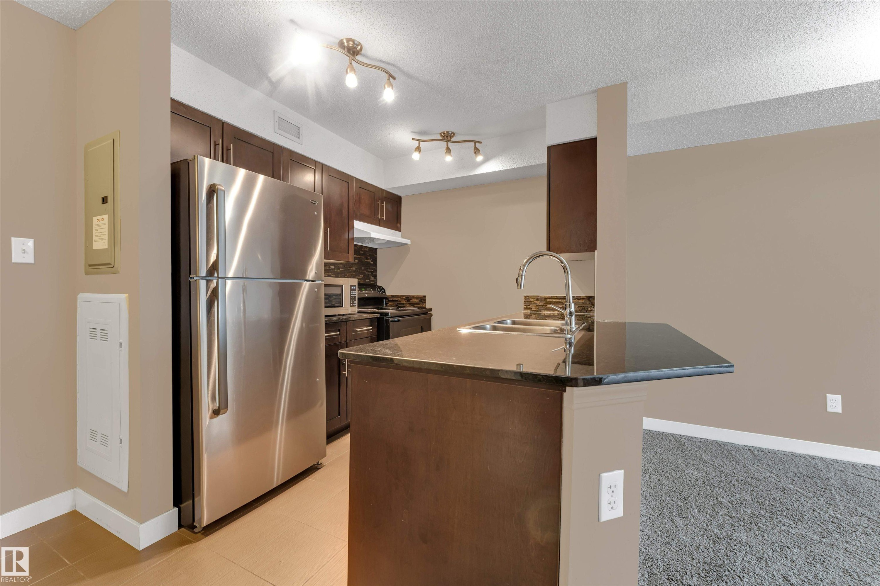 #209 11812 22 Av Sw Sw, Edmonton, AB - Indoor Photo Showing Kitchen With Double Sink