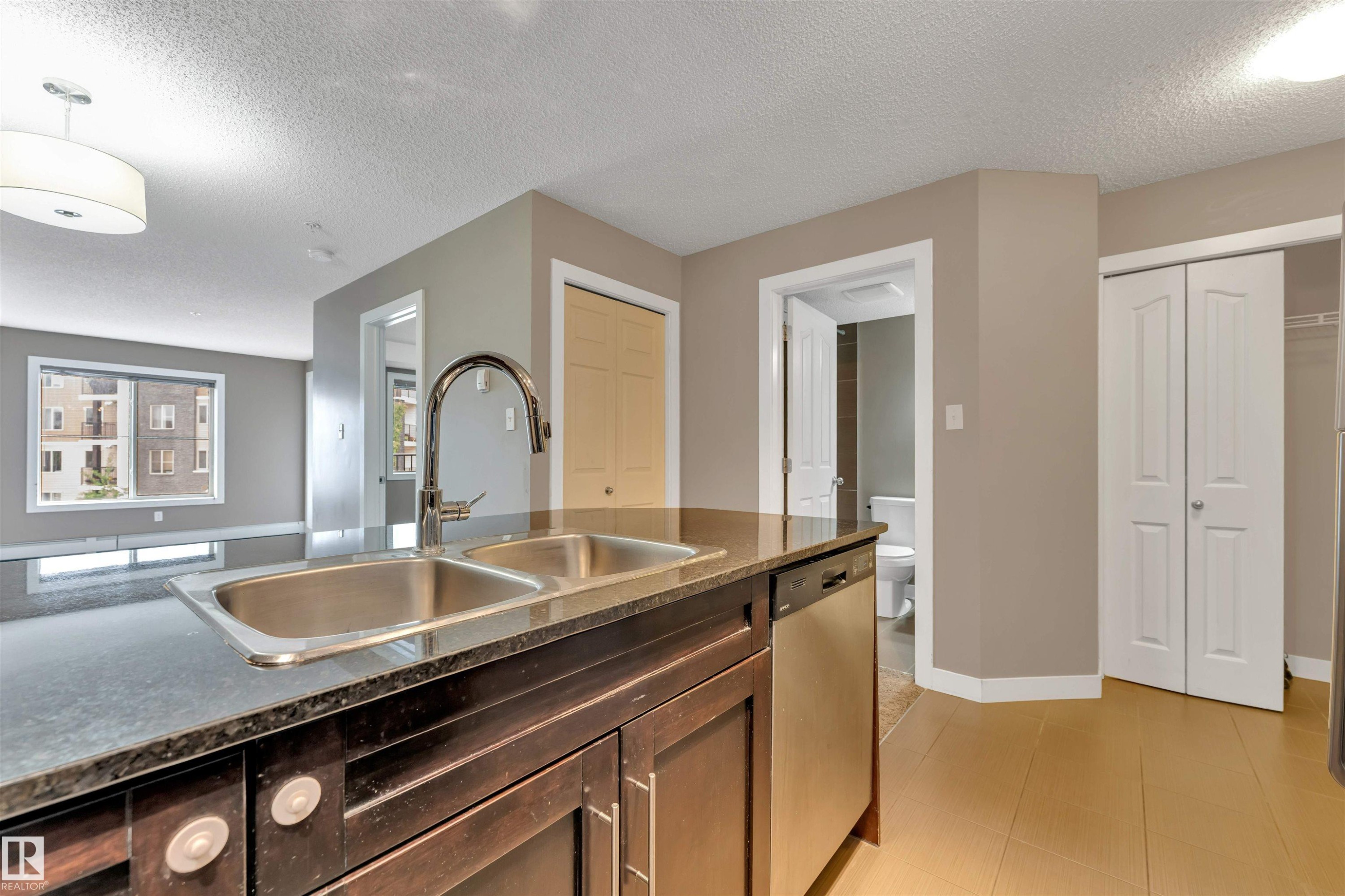 #209 11812 22 Av Sw Sw, Edmonton, AB - Indoor Photo Showing Kitchen With Double Sink