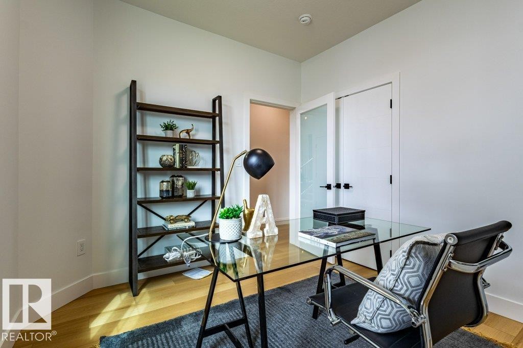 Room featuring wood-finish flooring and white walls - 82 Wynn Rd, Fort Saskatchewan, AB