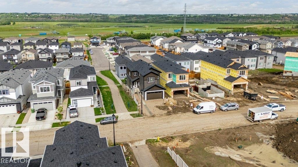 Newly developed residential neighborhood featuring a mix of completed homes and properties under construction - 82 Wynn Rd, Fort Saskatchewan, AB