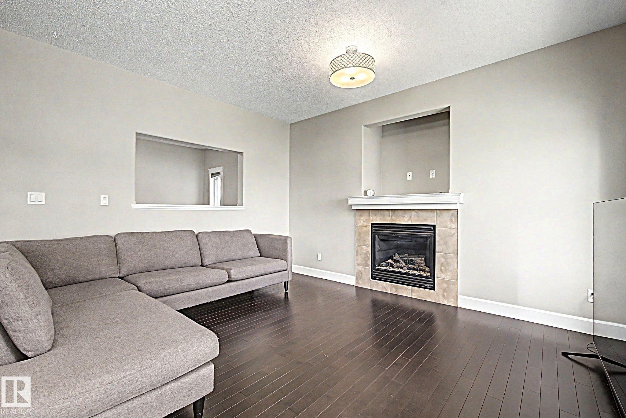1932 67 Street, Edmonton, AB - Indoor Photo Showing Living Room With Fireplace