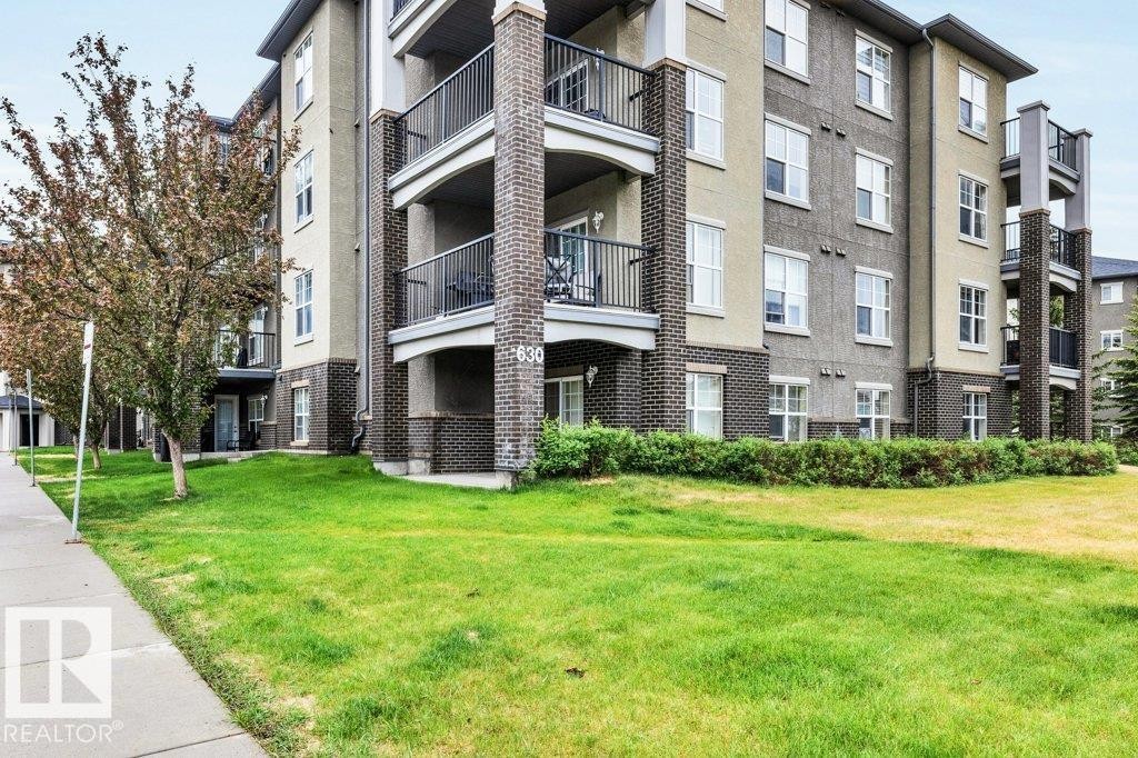 Multi-story building featuring brick and stucco exterior - 116 630 Mcallister Loop, Edmonton, AB