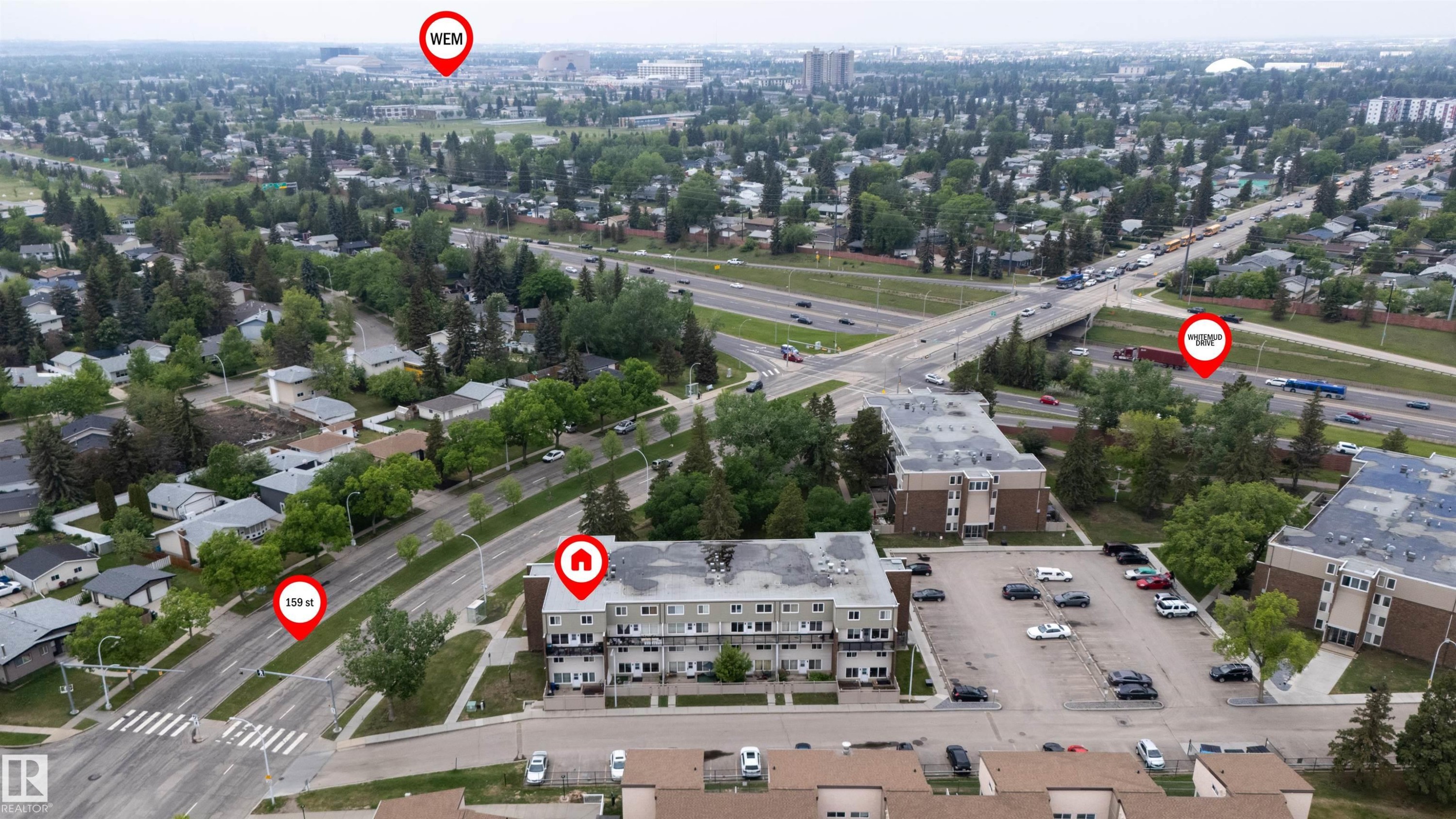 Aerial perspective showcasing the property's proximity to major roadways and urban infrastructure - #110 7805 159 St Nw, Edmonton, AB