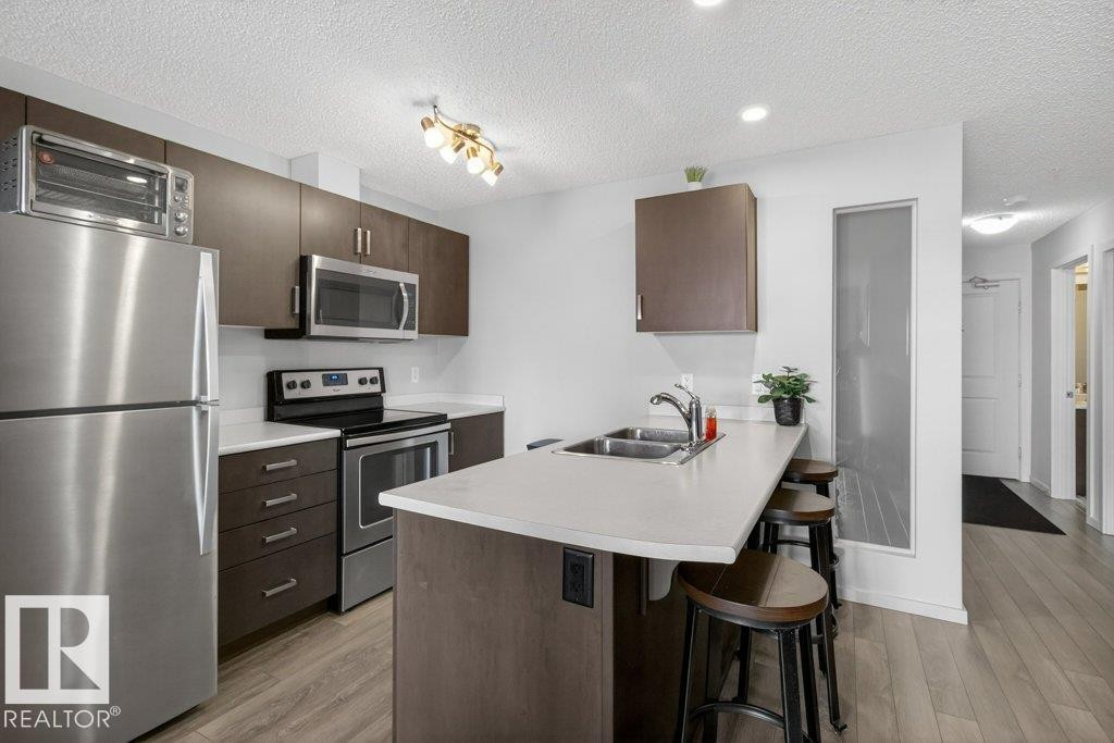 #315 142 Ebbers Bv Nw, Edmonton, AB - Indoor Photo Showing Kitchen With Double Sink With Upgraded Kitchen