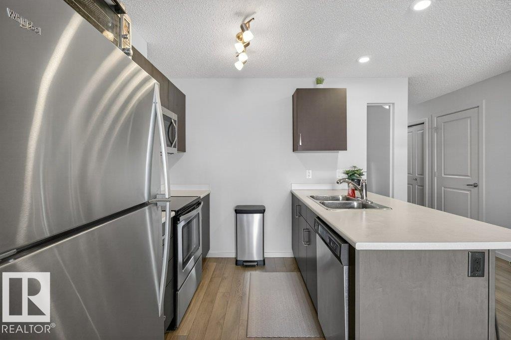#315 142 Ebbers Bv Nw, Edmonton, AB - Indoor Photo Showing Kitchen With Double Sink With Upgraded Kitchen