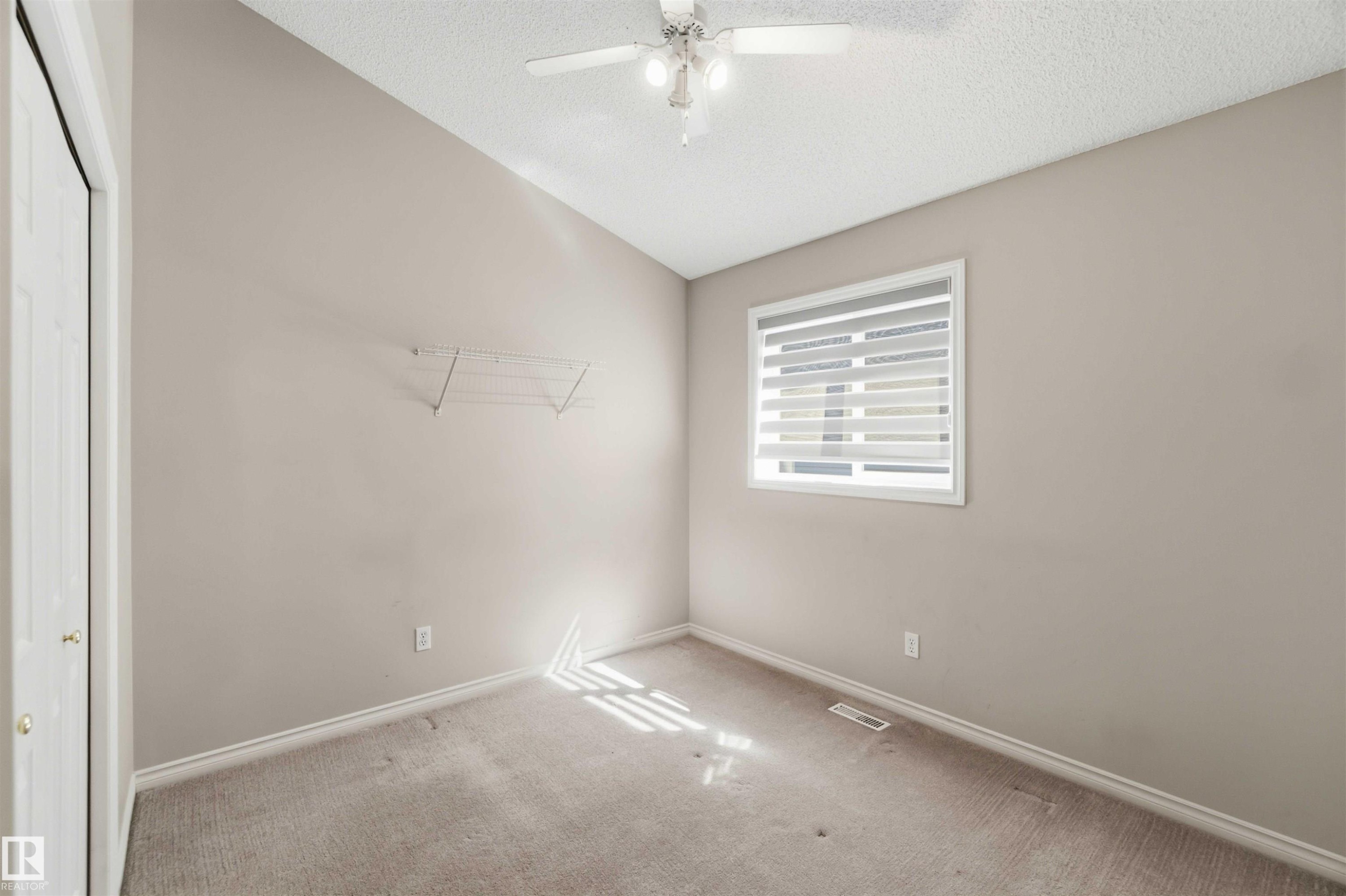 Neutral-toned walls complement the carpeted flooring - 2012 35A Avenue, Edmonton, AB