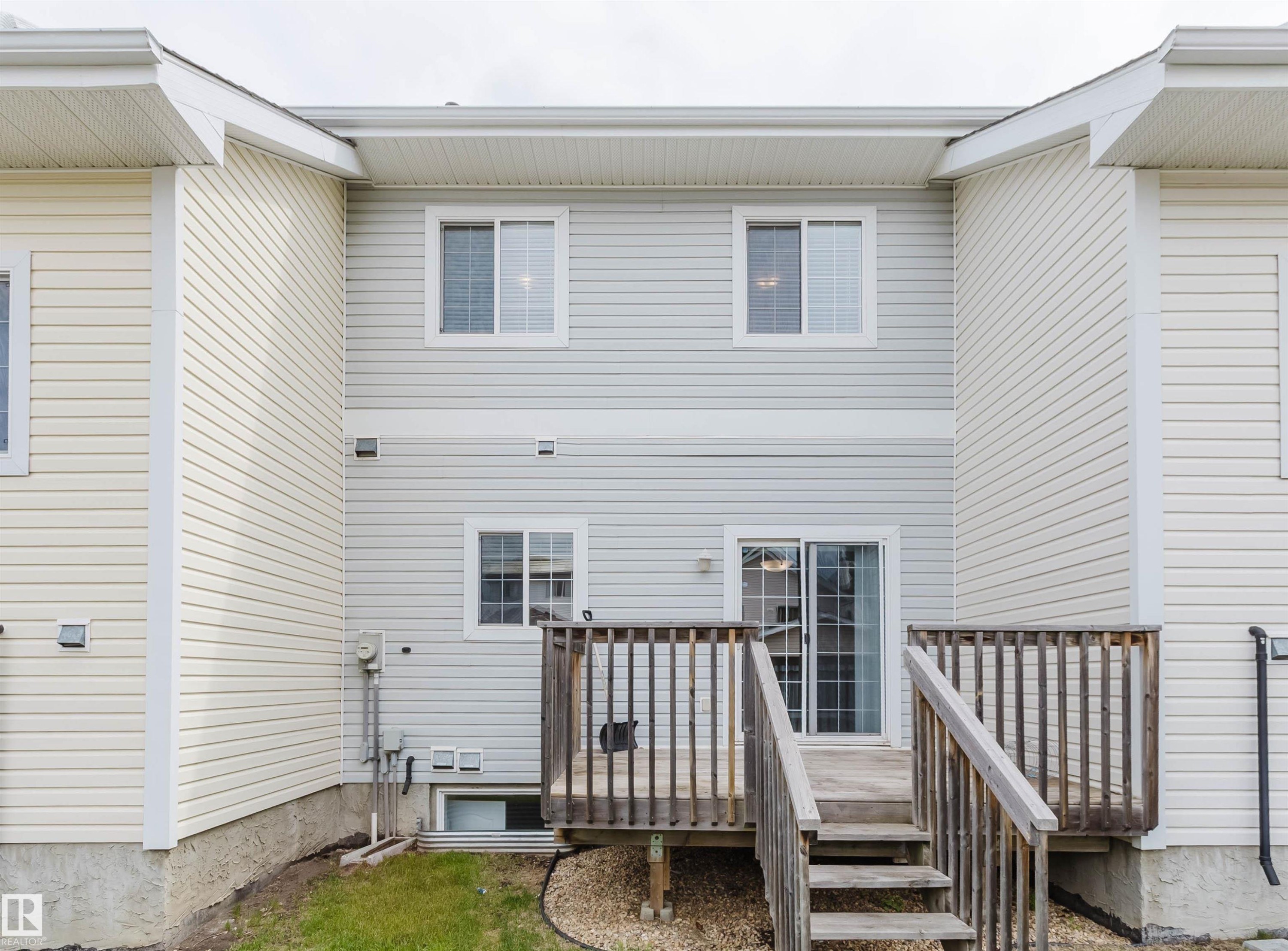 Multi-level rear deck with wood railing - 38 1780 Glastonbury Boulevard, Edmonton, AB