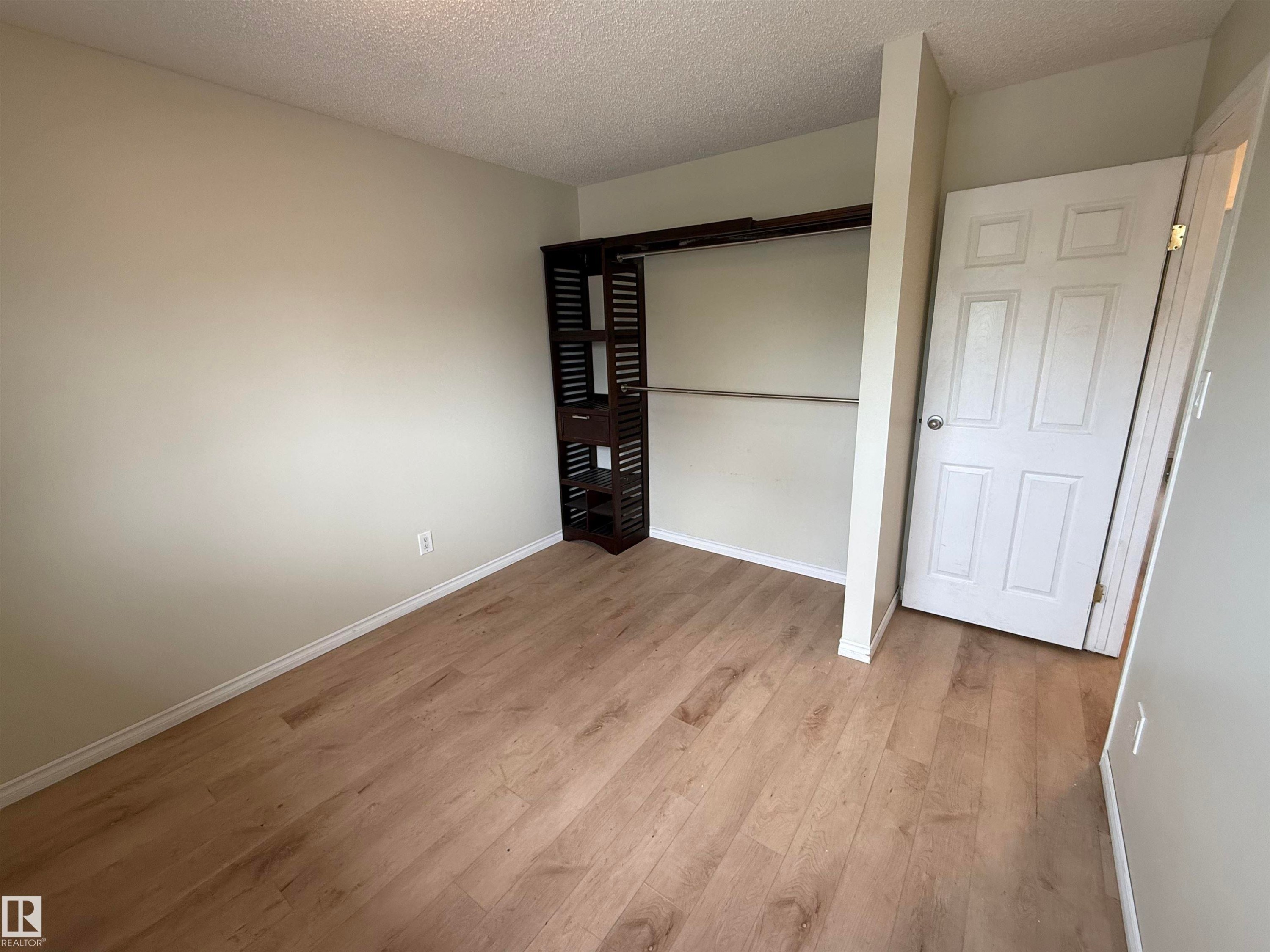 Neutral wall color with wood-finish flooring - 14537 121 Street, Edmonton, AB