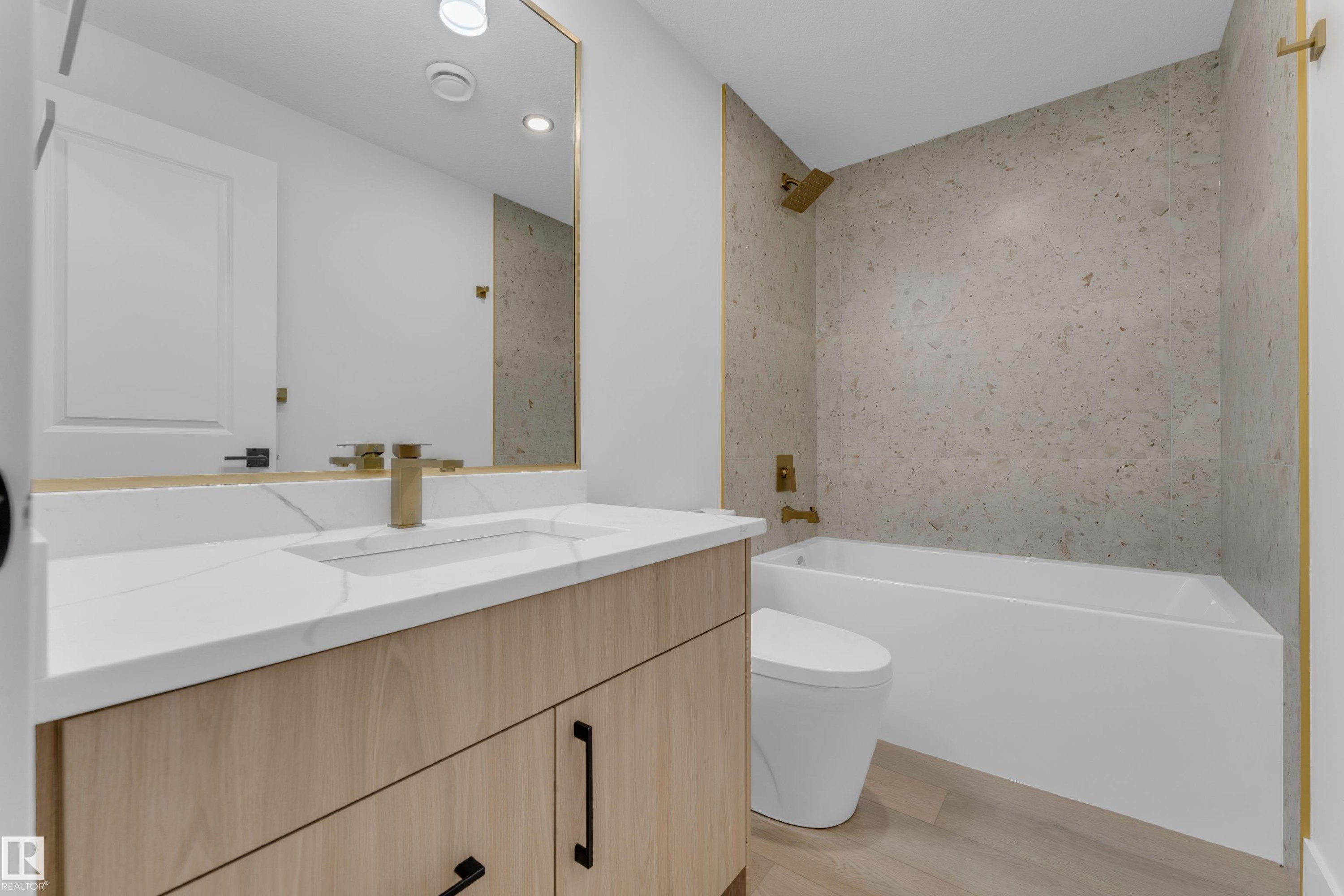 Bathroom featuring a light wood-finish vanity with a white countertop and integrated sink - 206 Linden Loop, Leduc, AB