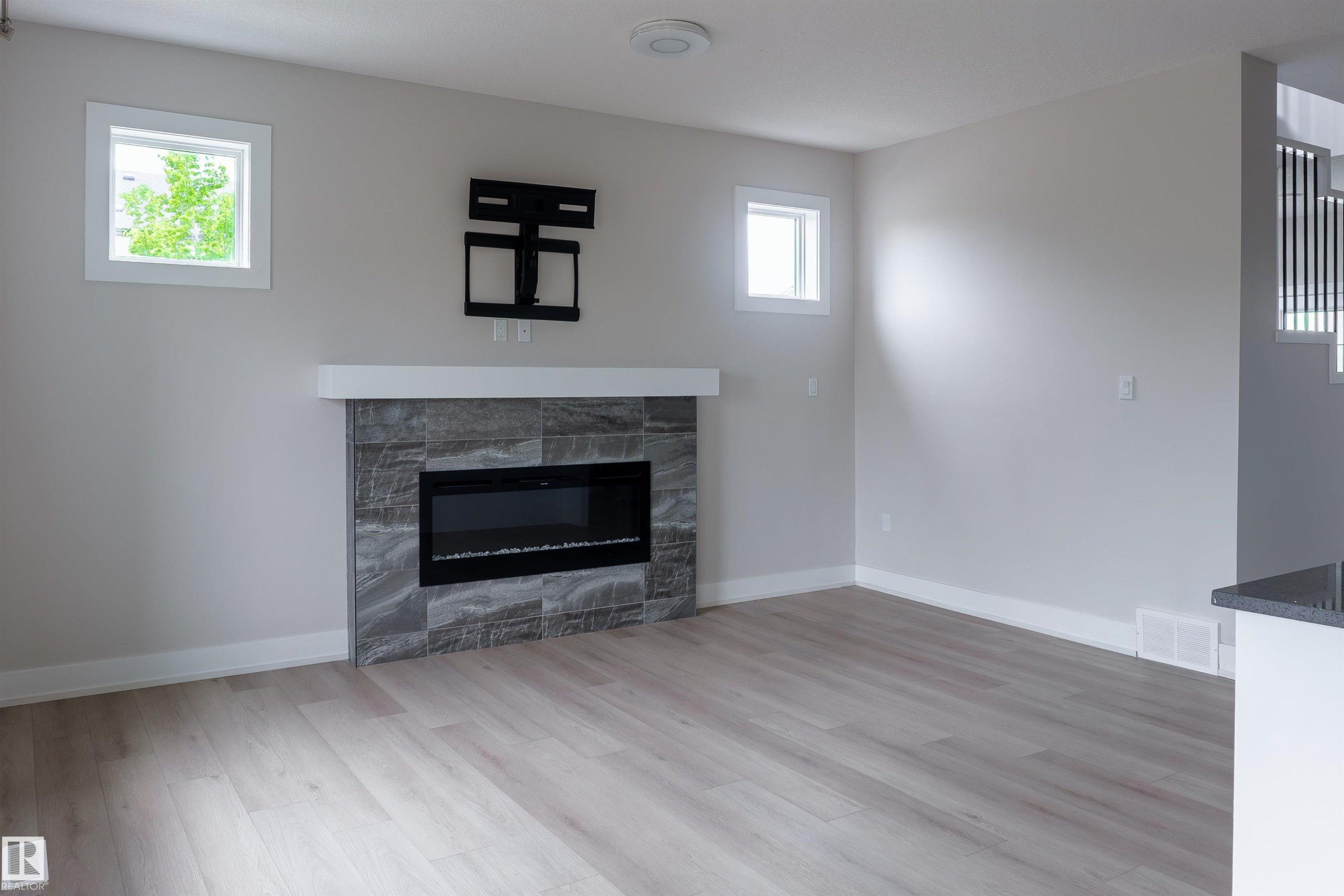 2104 160 Street Sw, Edmonton, AB - Indoor Photo Showing Living Room With Fireplace