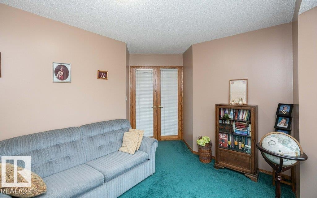 Interior space featuring a textured ceiling and light-toned walls - 60230 Rg Rd 271, Rural Westlock County, AB