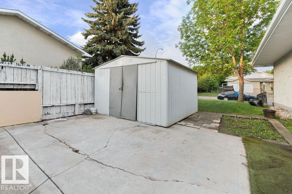 Freestanding metal utility shed with double doors - 712 Lee Ridge Road, Edmonton, AB