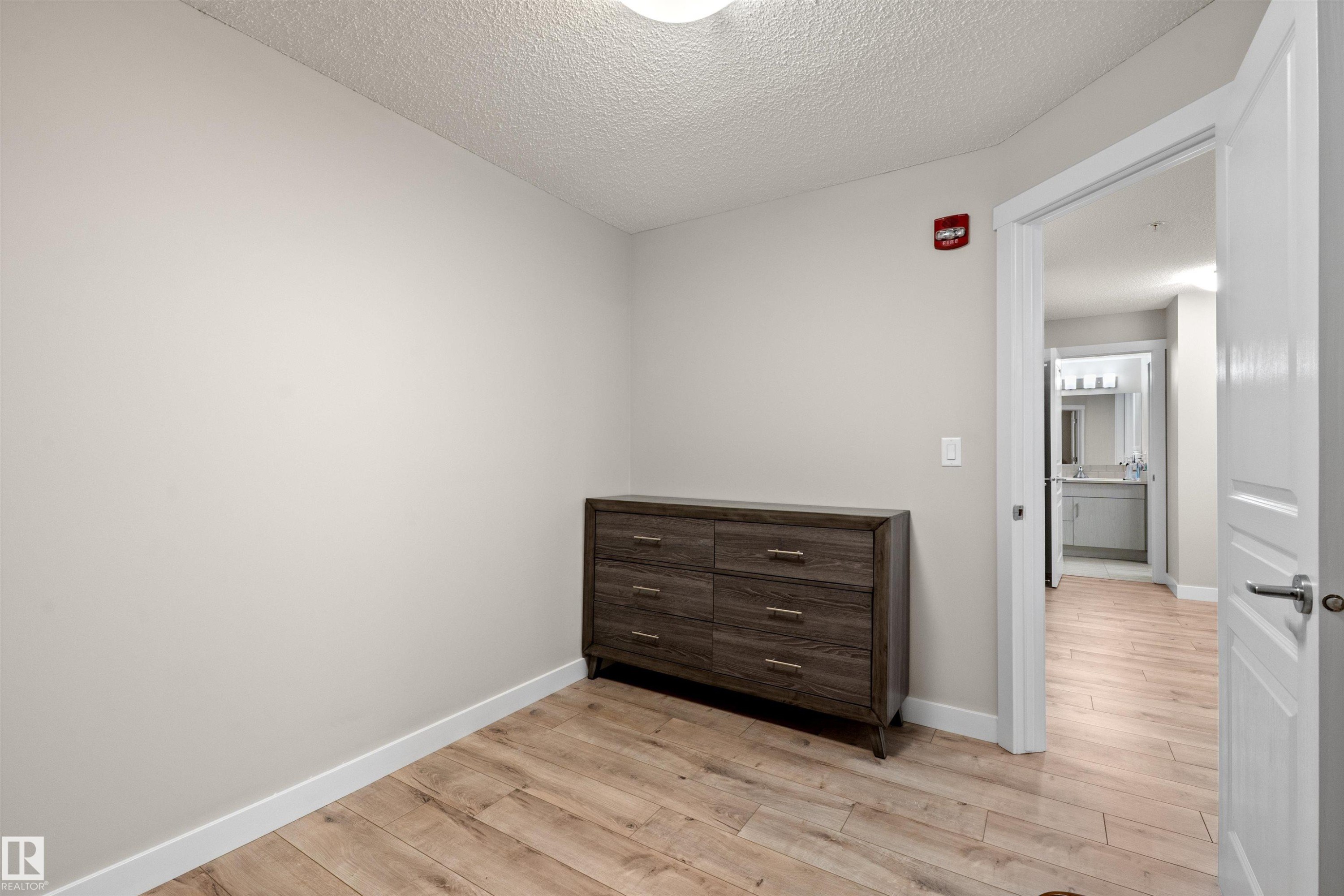 Light wood-finish flooring - 210 2229 44 Avenue, Edmonton, AB