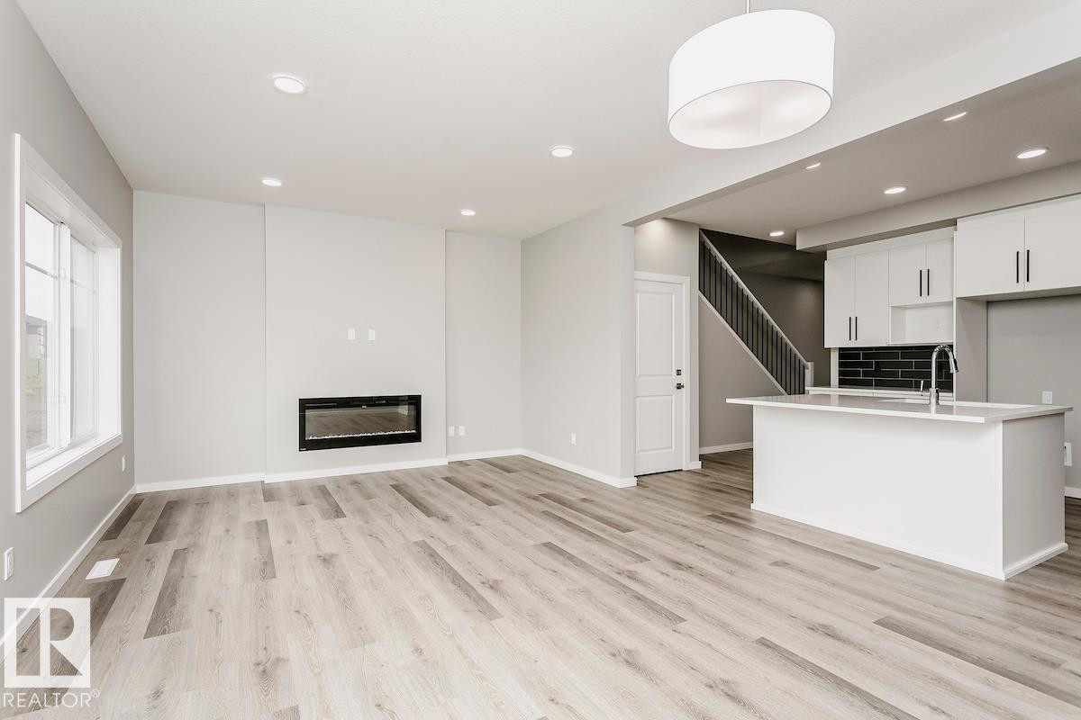 2480 Egret Loop Nw, Edmonton, AB - Indoor With Fireplace