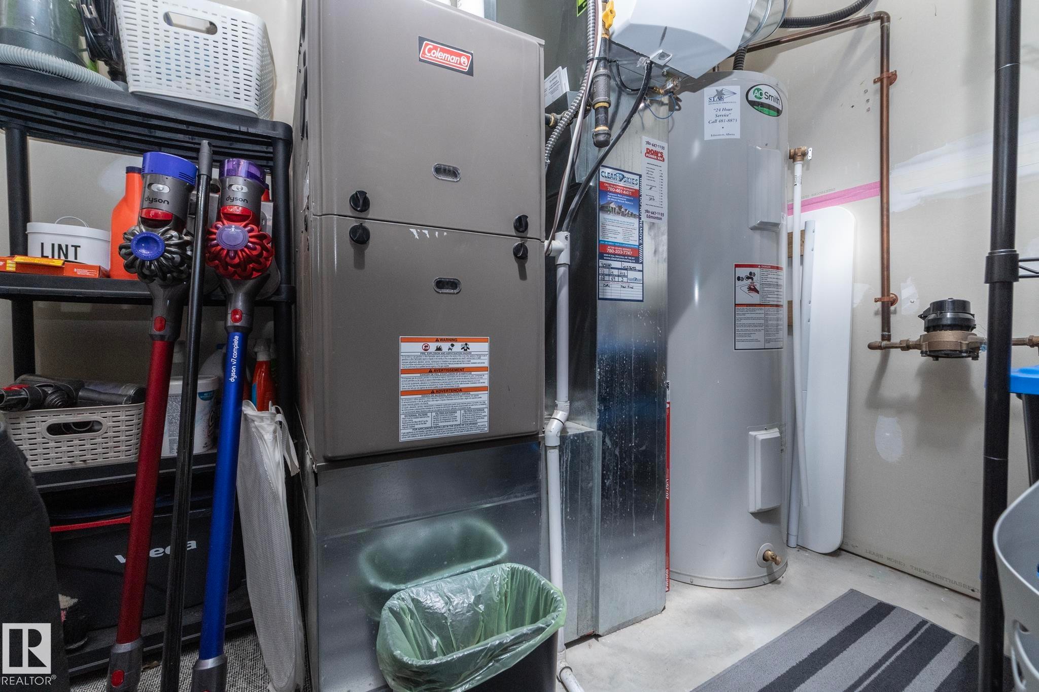 Modern mechanical systems featuring a Coleman furnace and a large hot water heater - 46 4050 Savaryn Drive, Edmonton, AB
