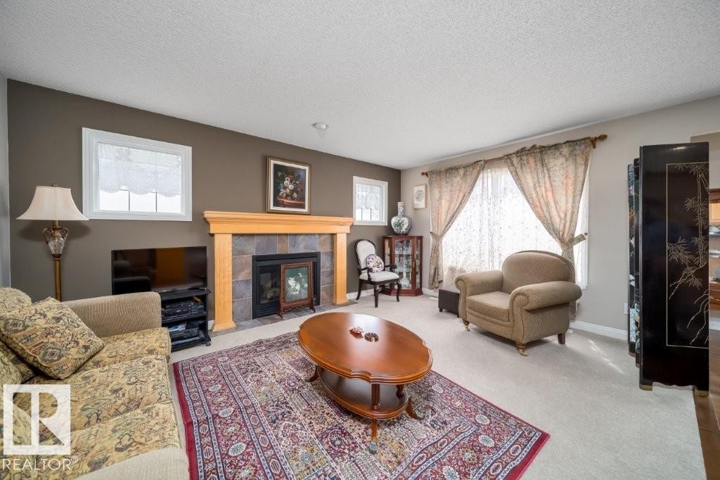 2577 Hanna Crescent, Edmonton, AB - Indoor Photo Showing Living Room With Fireplace