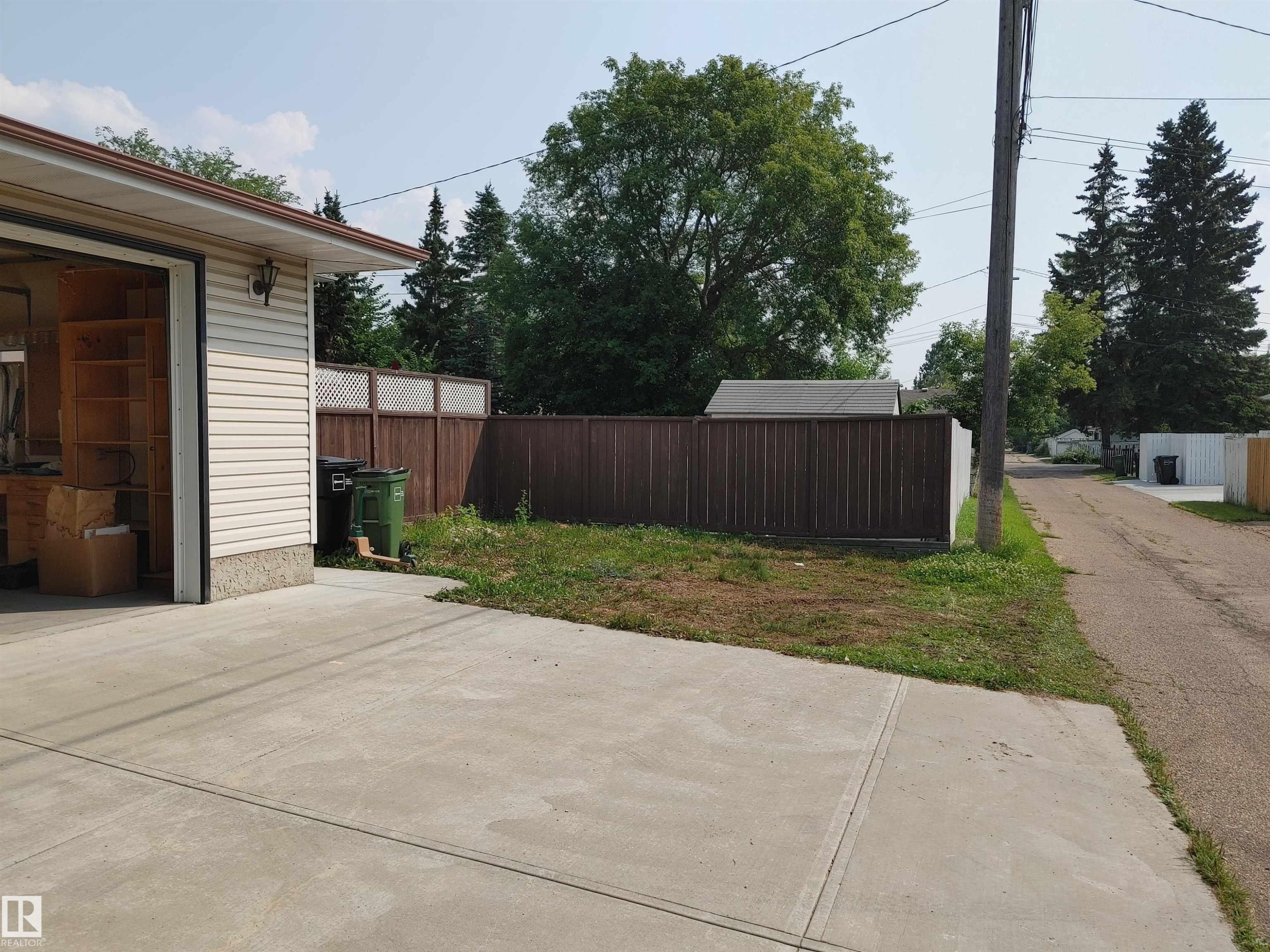 Your detached garage boasts a large driveway and another huge space that can be used for RV parking or just additional vehicles. - 9608 150 Street Nw, Edmonton, AB