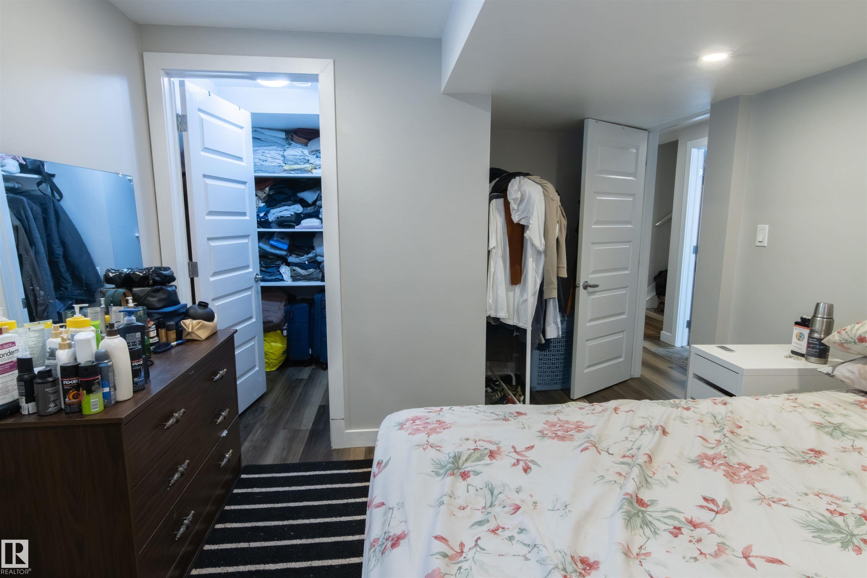 Interior room featuring light gray walls and wood-finish flooring - 4004 88 Street Nw, Edmonton, AB - Indoor Photo Showing Bedroom