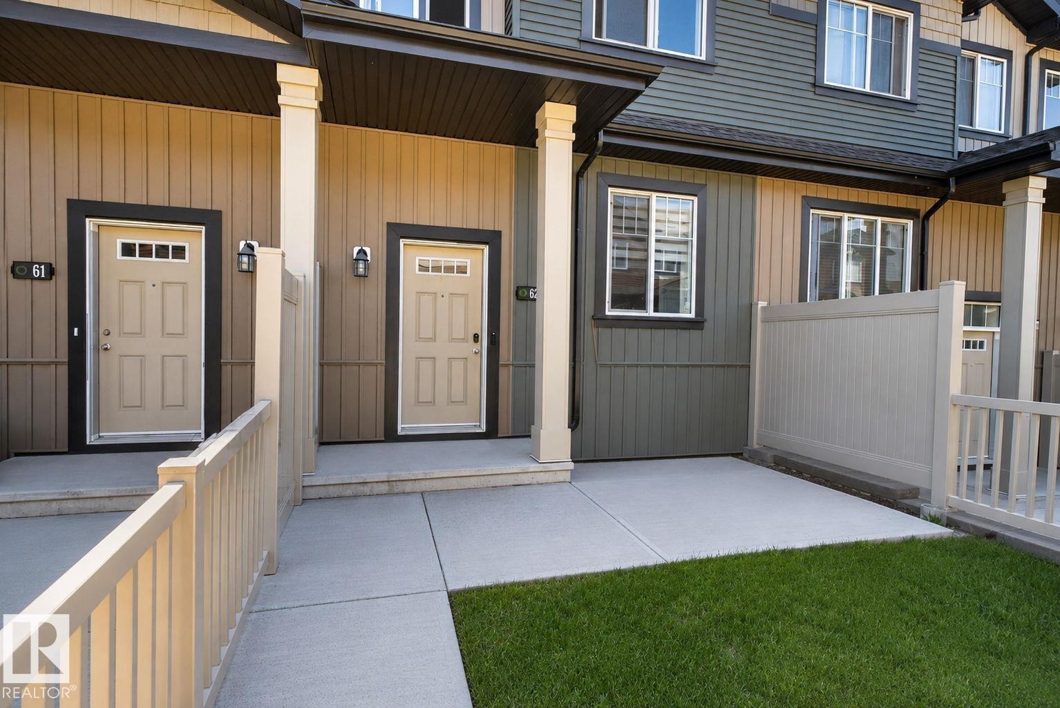 Townhome exterior featuring horizontal siding in beige and grey tones - 62 3305 Orchards Link, Edmonton, AB