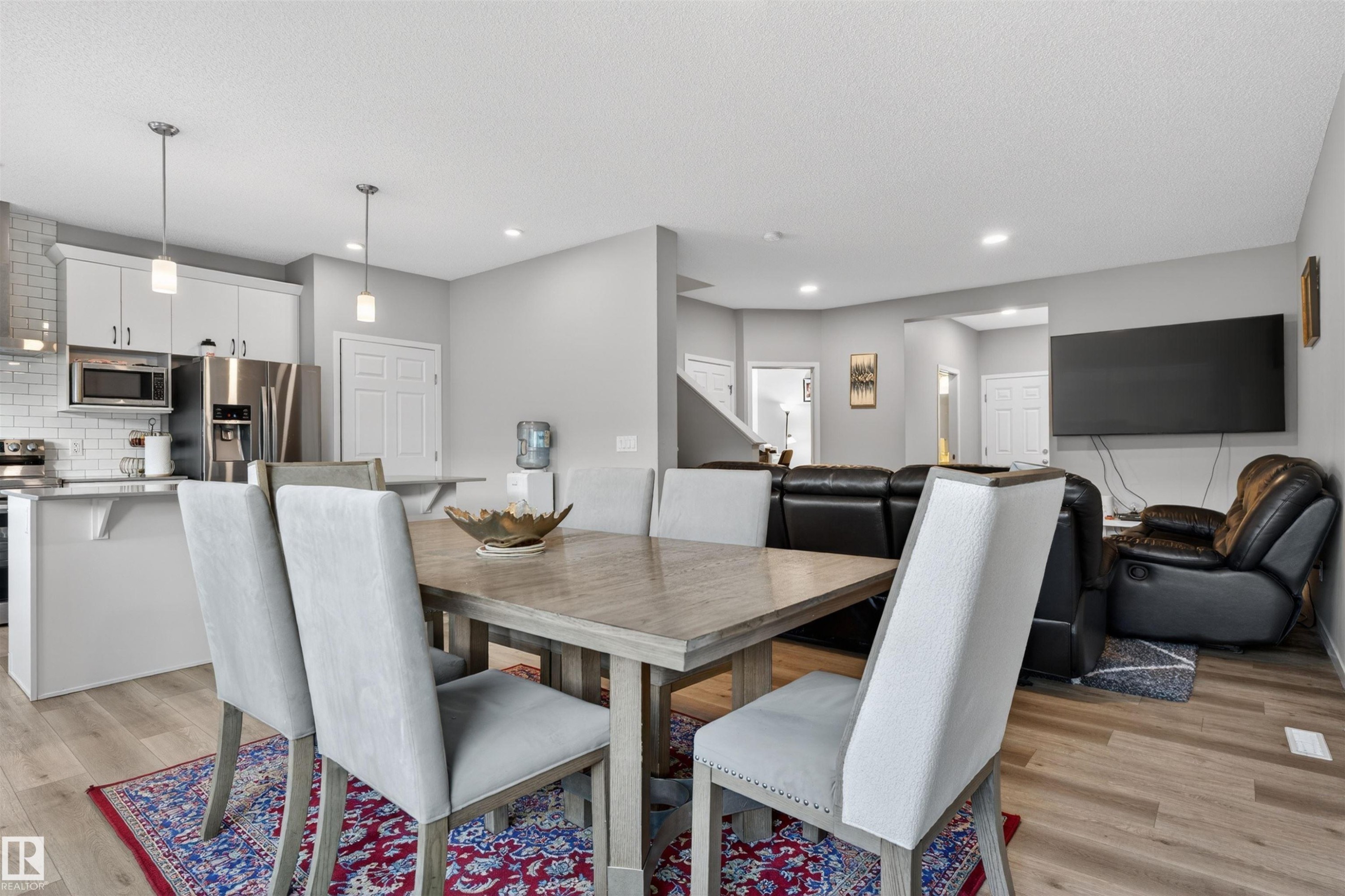 Modern kitchen with white cabinetry and stainless steel appliances - 22638 99A Avenue, Edmonton, AB