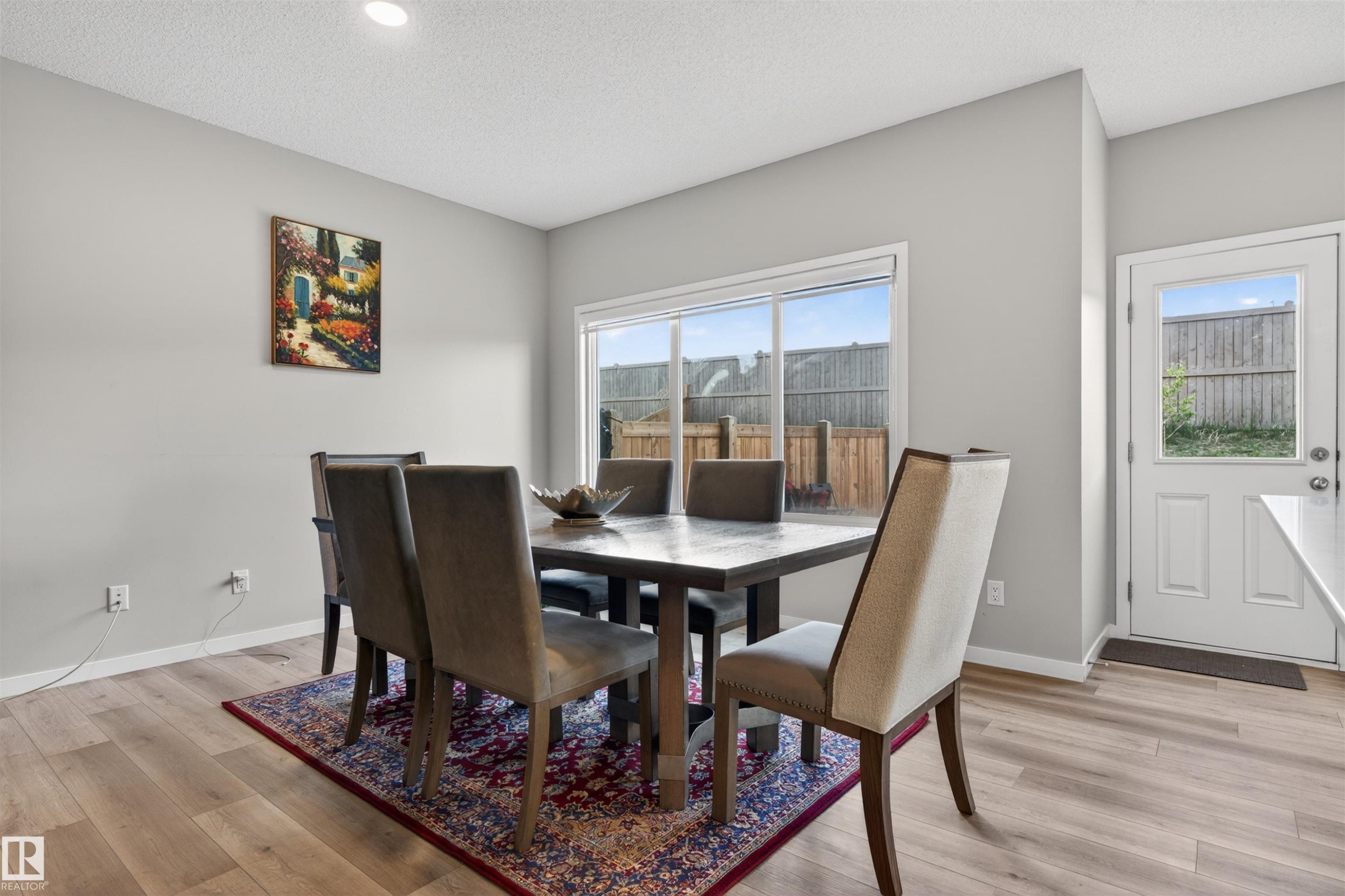 Dining space featuring wood-finish flooring, recessed lighting, and neutral wall tones - 22638 99A Avenue, Edmonton, AB