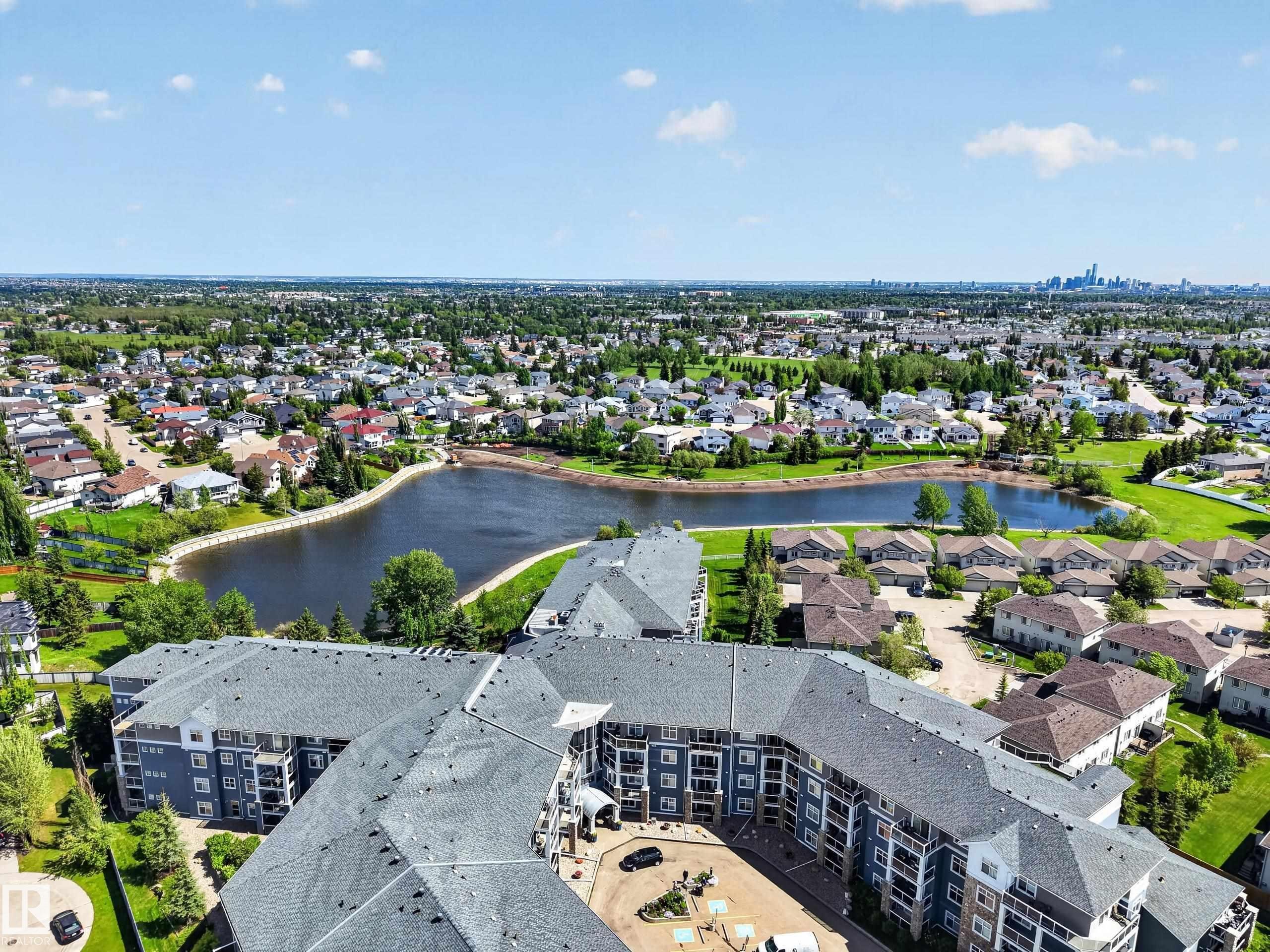 Extensive aerial perspective showcasing a residential building with a central courtyard - 138 16035 132 Street, Edmonton, AB