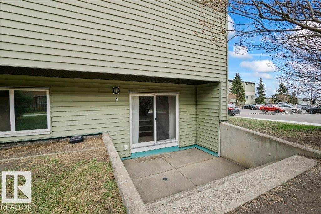 Private concrete patio with direct exterior access - #1 13450 Fort Rd Nw, Edmonton, AB - Outdoor With Deck Patio Veranda With Exterior
