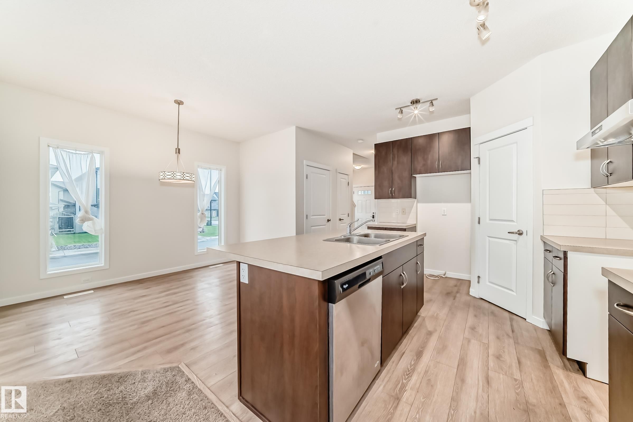 Open concept living space featuring wood-finish flooring - 18103 77 Street, Edmonton, AB