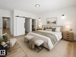 Bedroom featuring light wood-finish flooring, a decorative shiplap accent wall, and recessed ceiling lighting -