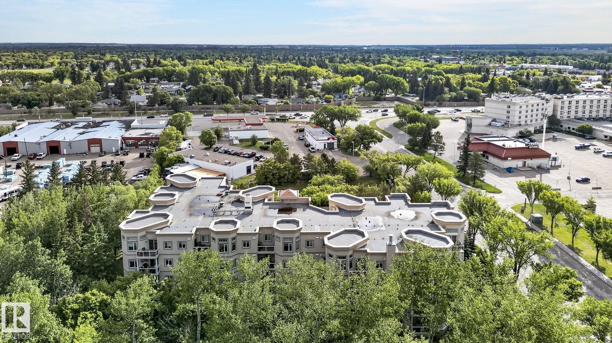 Multi-story residential building with private balconies and a flat roofline - 208 5 Gate Avenue, St. Albert, AB