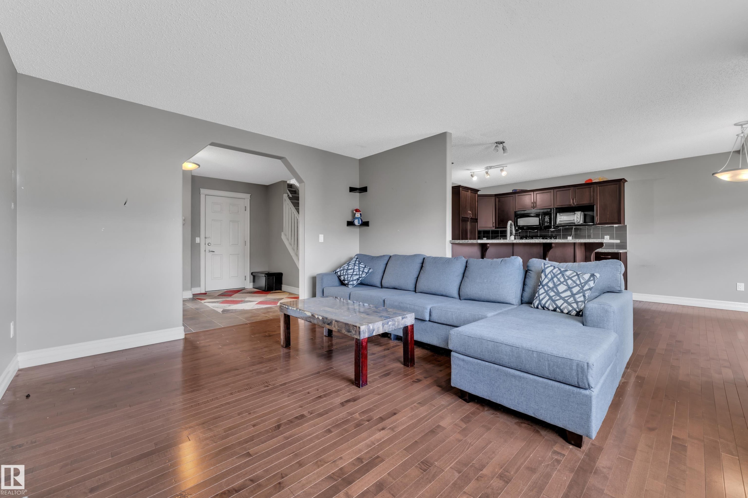 Hardwood-finish flooring throughout the main living area - 6116 11 Avenue, Edmonton, AB