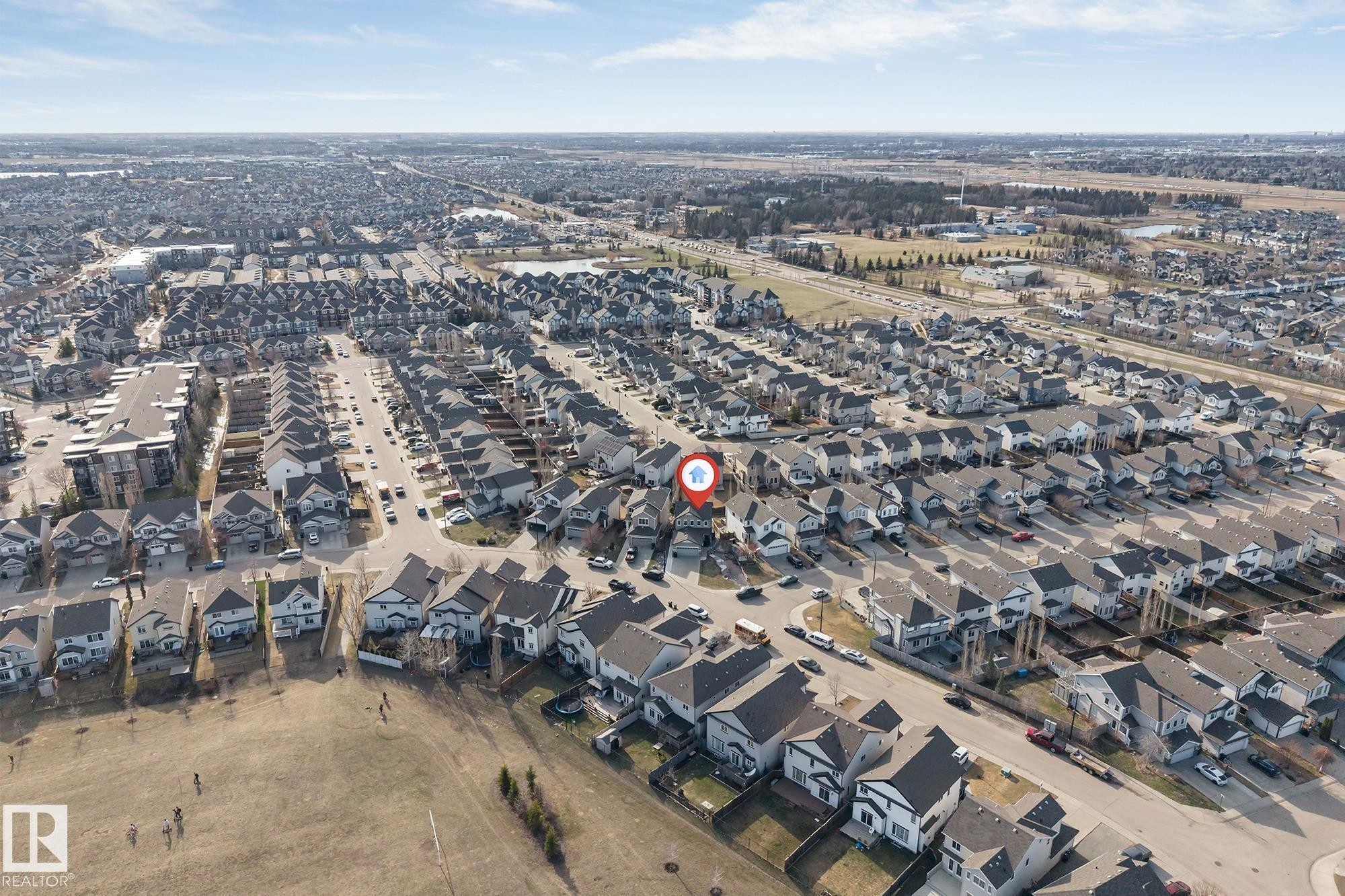 Aerial perspective showcasing a residential neighborhood with numerous single-family homes - 5928 12 Avenue, Edmonton, AB