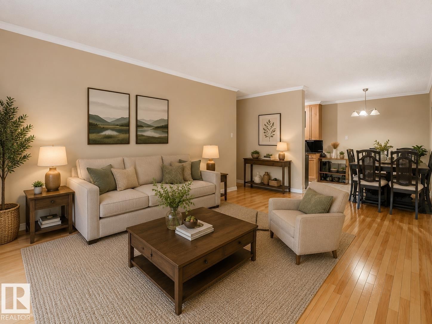 Living area featuring wood-finish flooring, crown molding, and neutral wall tones - #403 10165 113 St Nw, Edmonton, AB
