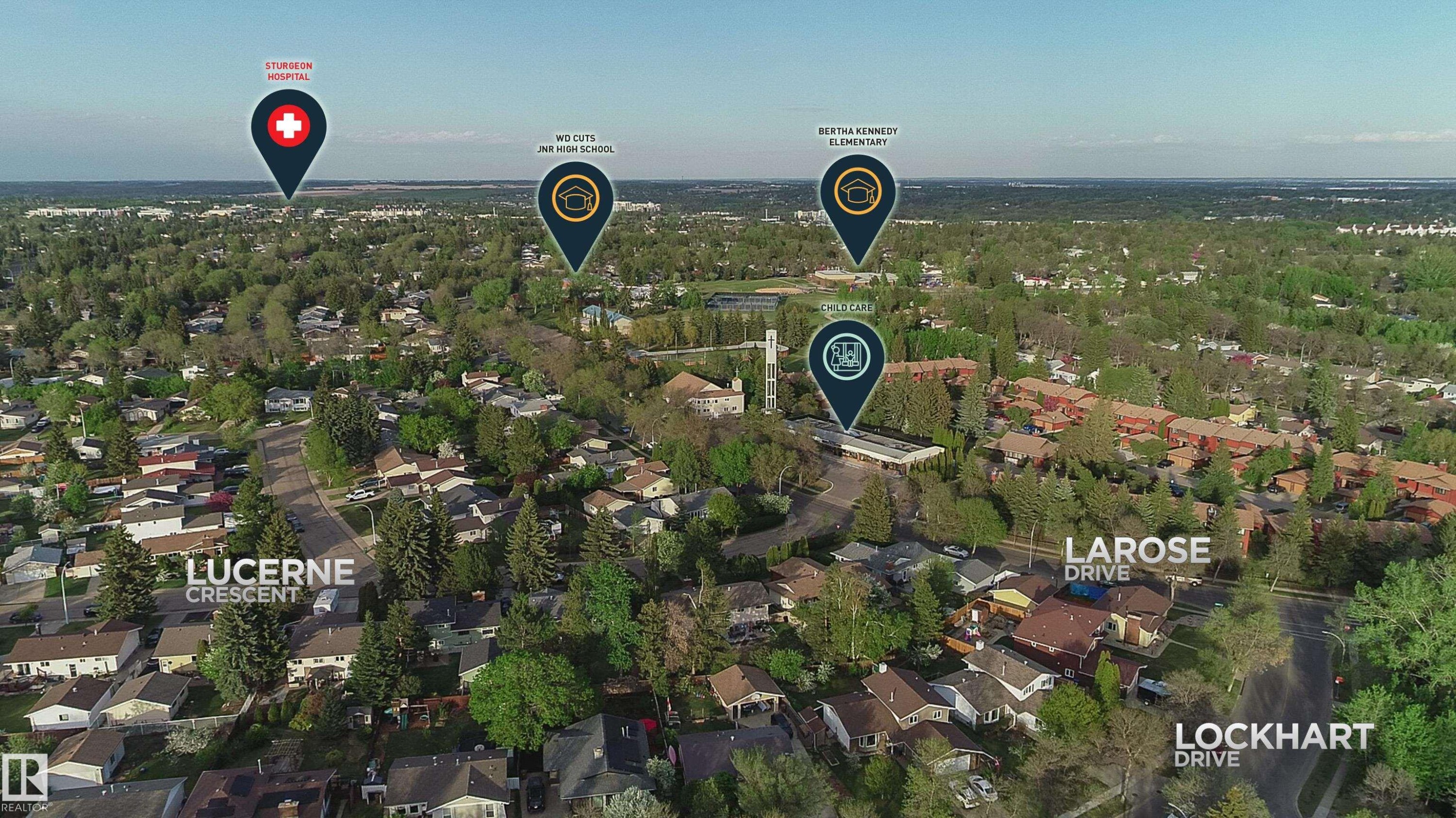 Aerial perspective showcasing a residential area with mature trees and established streets - 58 Lodgepole Crescent, St. Albert, AB