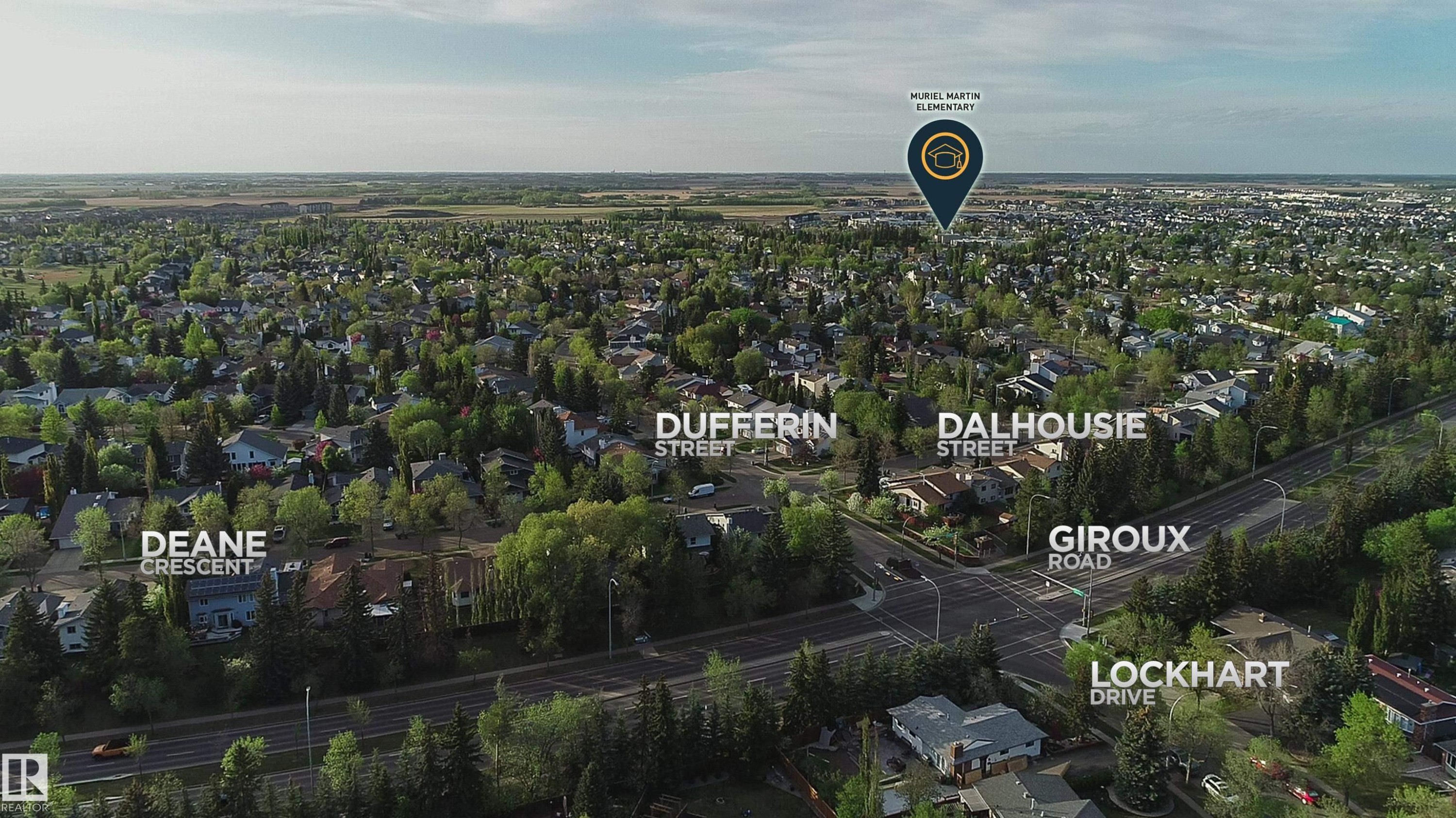 Expansive aerial perspective showcasing a mature residential area with abundant tree cover - 58 Lodgepole Crescent, St. Albert, AB