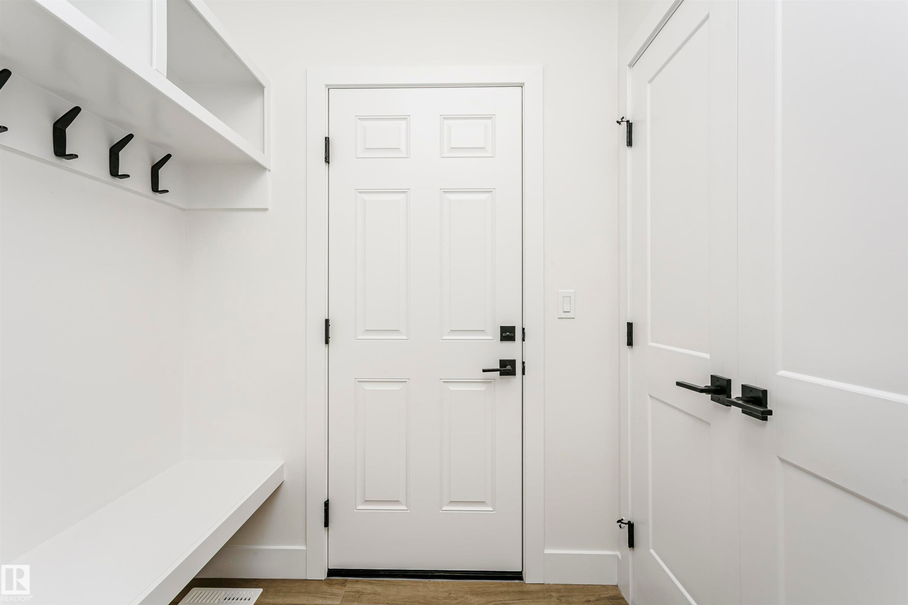 Mudroom with built-in bench seating and shelving - 6210 Dansereau Crescent, Beaumont, AB