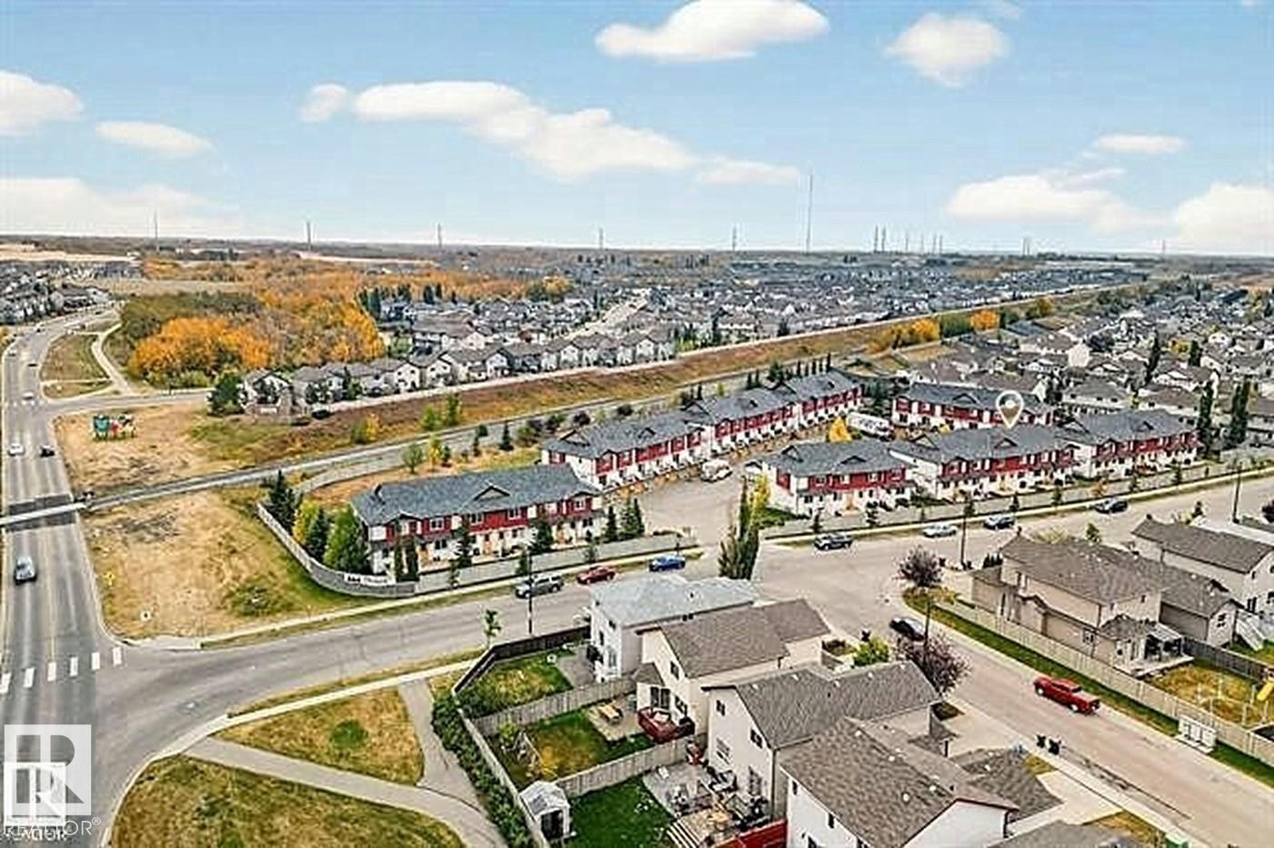 Aerial view showcasing the residential community with clear roads and green spaces - #13 3751 12 Street, Edmonton, AB