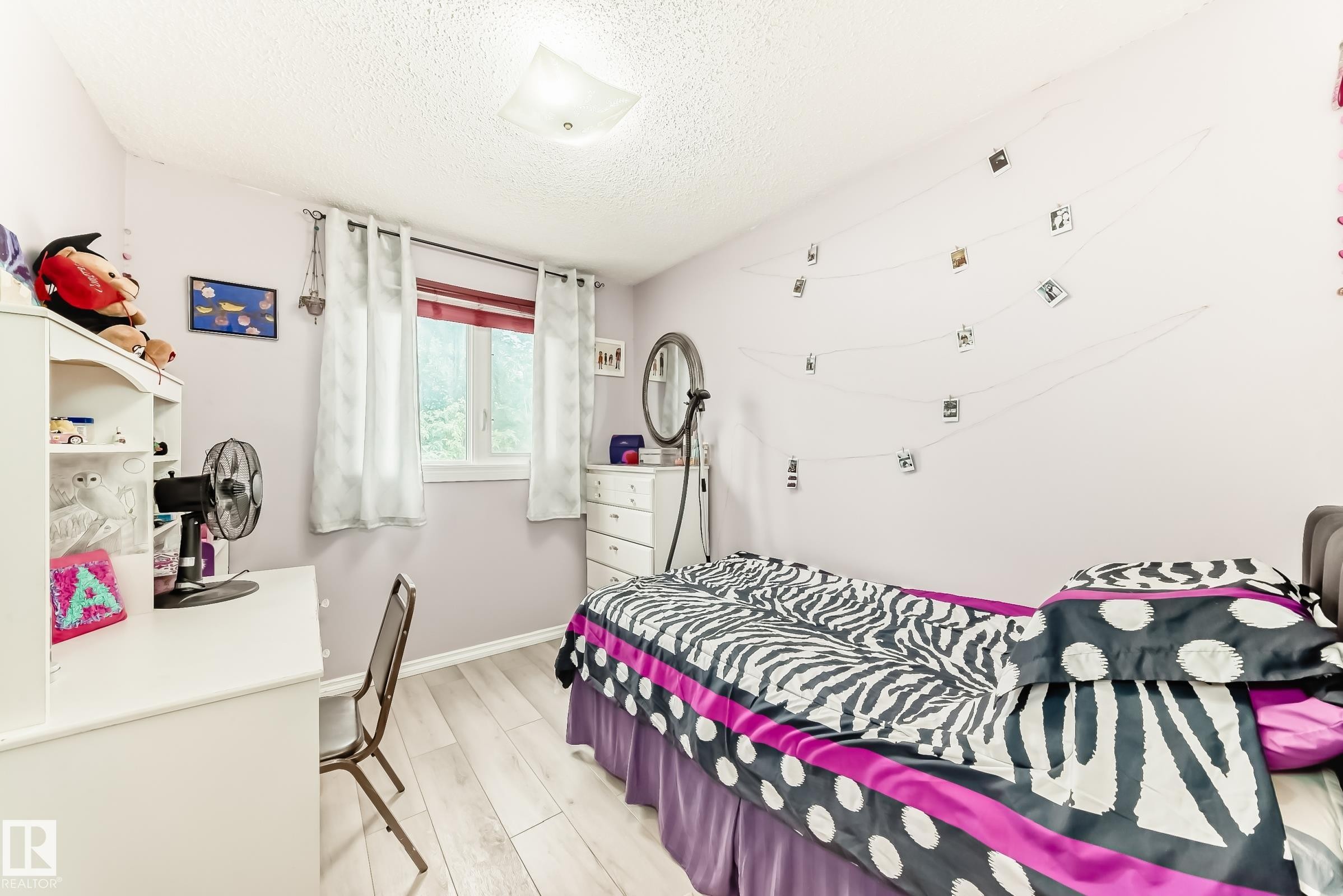 Room featuring light-toned wood-finish flooring - 3843 47 Street Nw, Edmonton, AB - Indoor Photo Showing Bedroom