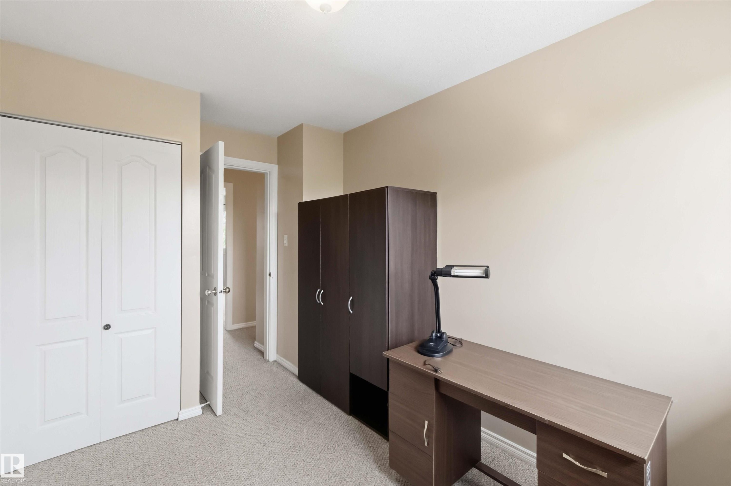 Light-toned carpeting complements neutral wall tones - 17325 85 Avenue Nw, Edmonton, AB