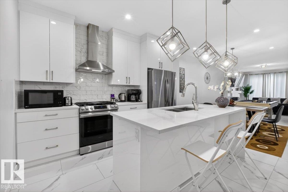 8090 Kiriak Link Sw, Edmonton, AB - Indoor Photo Showing Kitchen With Stainless Steel Kitchen With Double Sink With Upgraded Kitchen