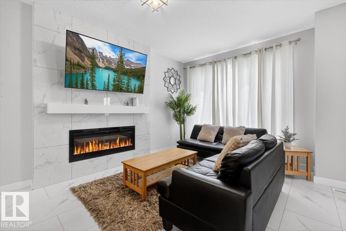 8090 Kiriak Link Sw, Edmonton, AB - Indoor Photo Showing Living Room With Fireplace