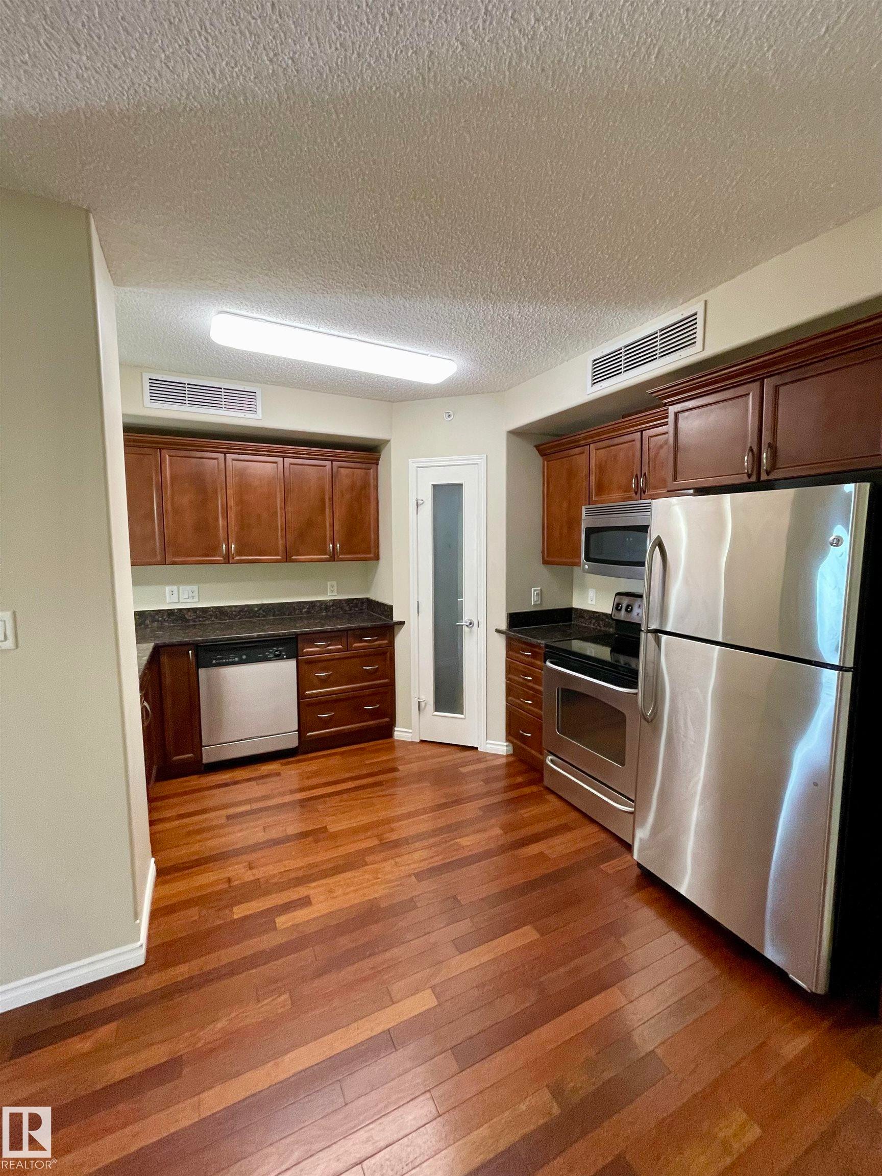 #205 9707 106 St Nw, Edmonton, AB - Indoor Photo Showing Kitchen With Stainless Steel Kitchen